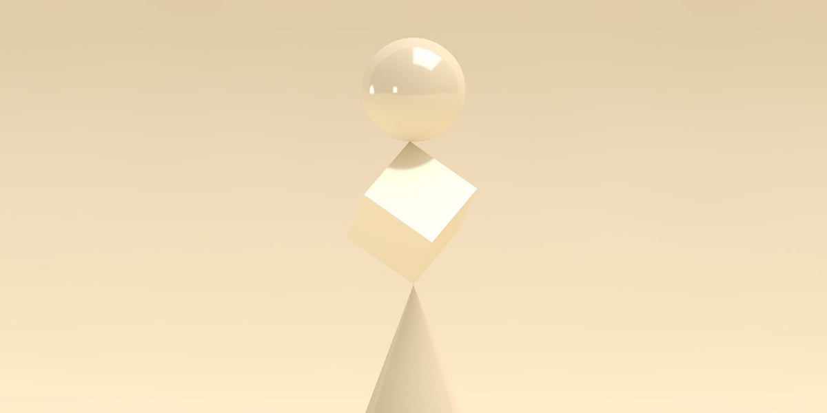 Sculptural display of unique contemporary art objects featuring geometric shapes and soft colors.