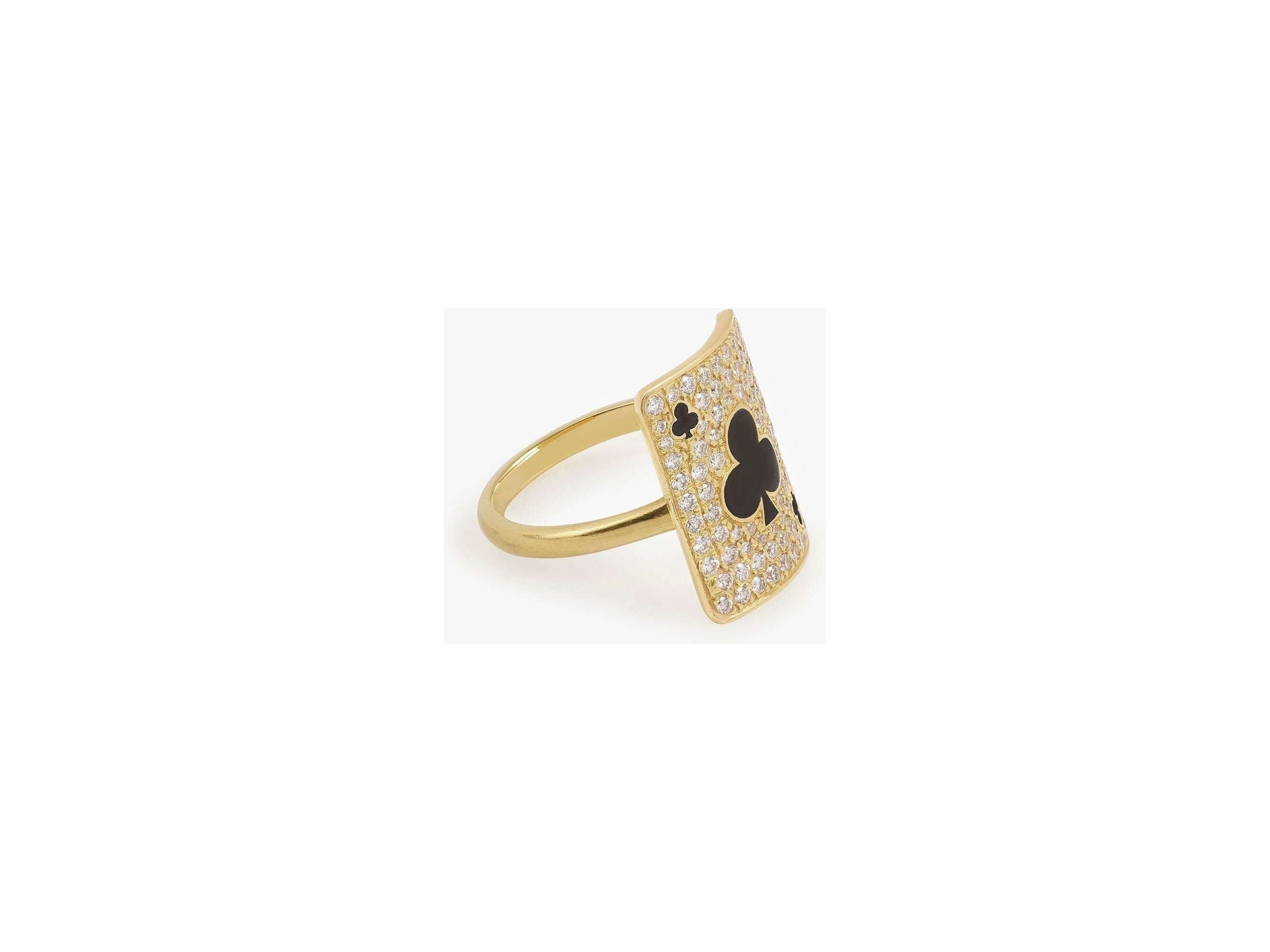 Gold ring featuring a card design with a clover motif, adorned with sparkling gemstones.