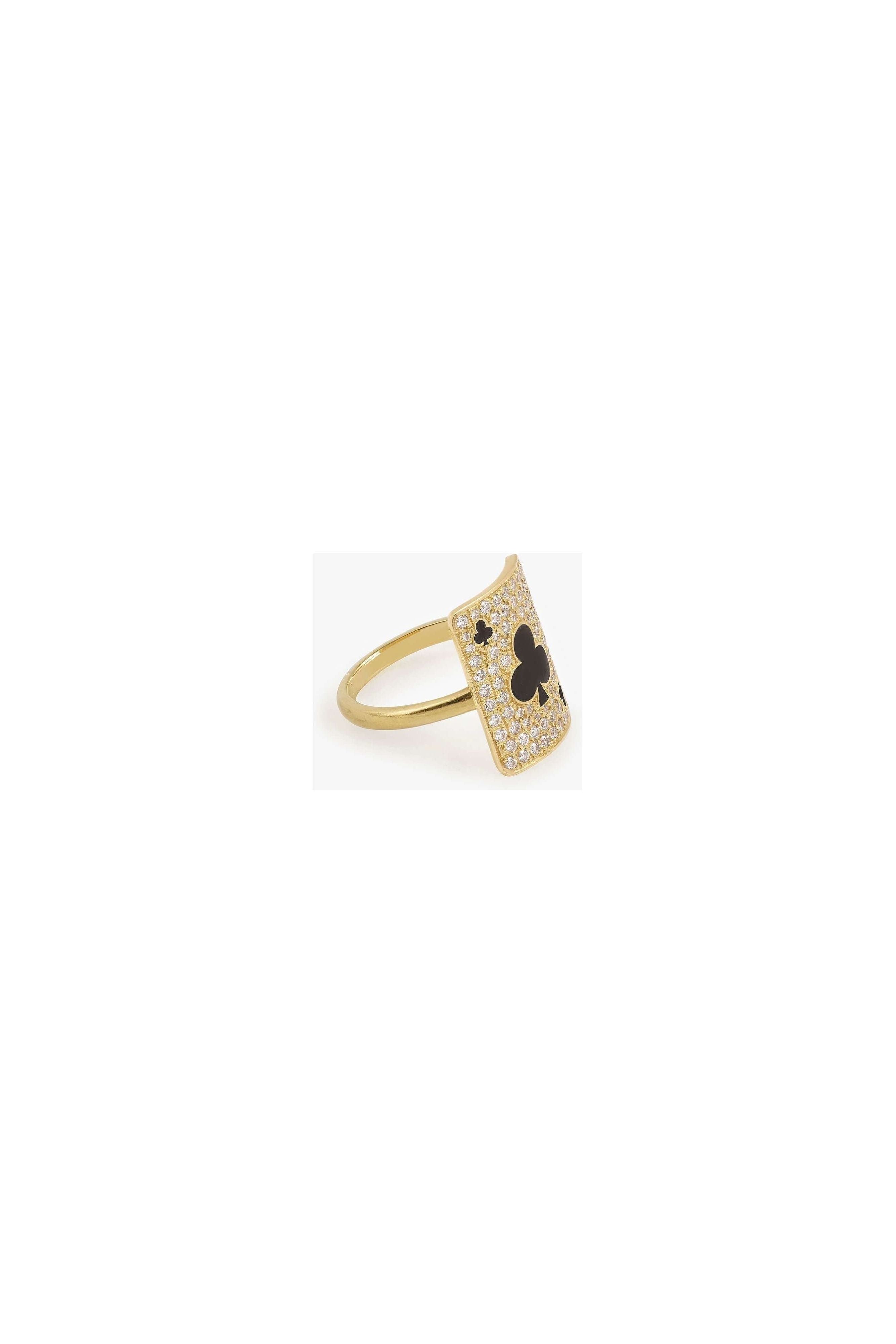 Gold ring featuring a card design with a clover motif, adorned with sparkling gemstones.