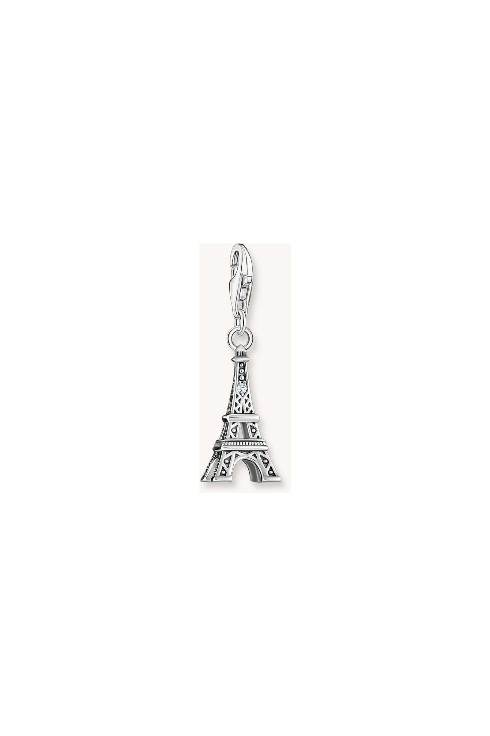 Charm pendant of the Eiffel Tower in recycled silver with a white zirconia, capturing vintage elegance.