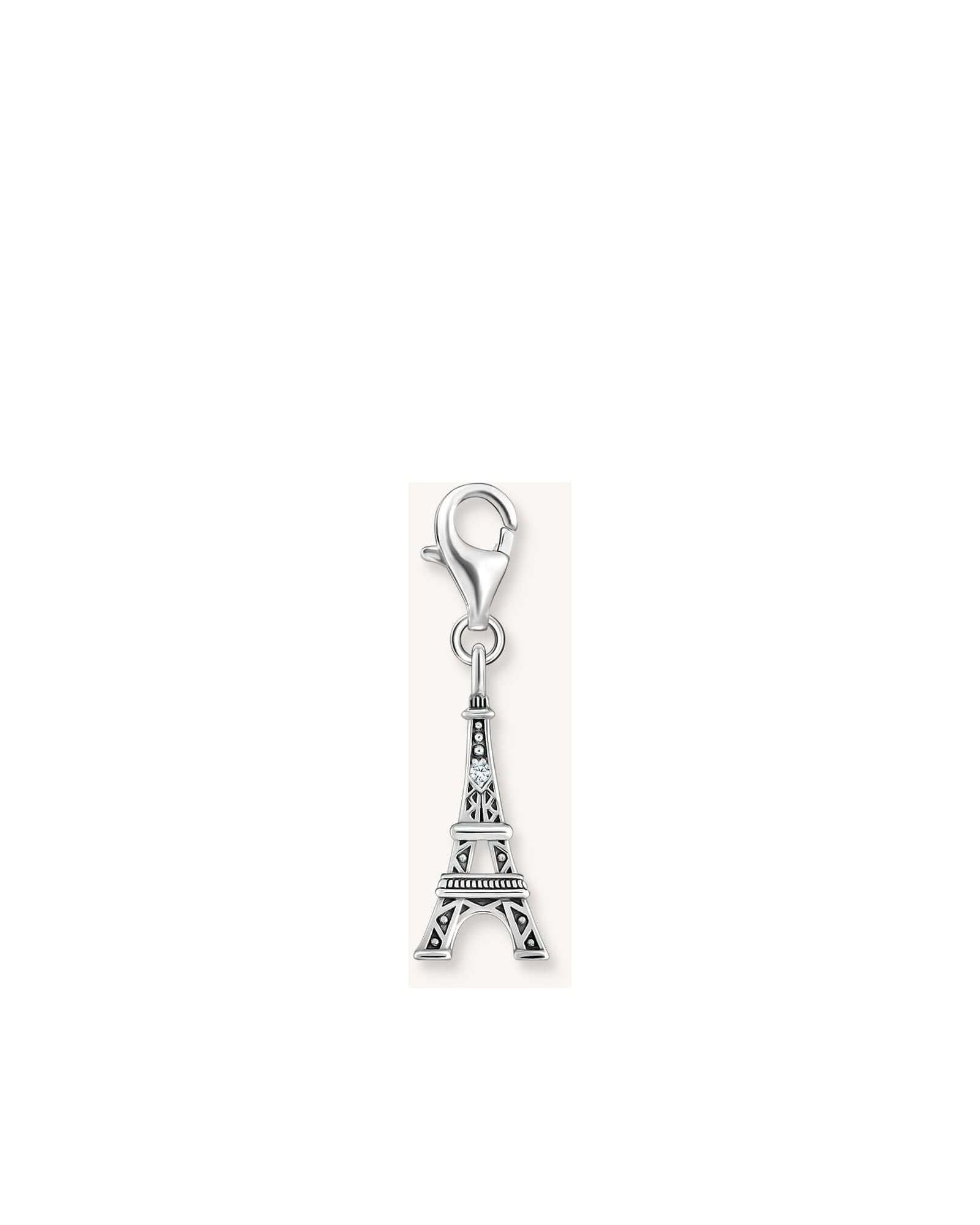 Pendentif charm en argent représentant la tour Eiffel, stylisé avec zircone blanche pour un effet vintage.
