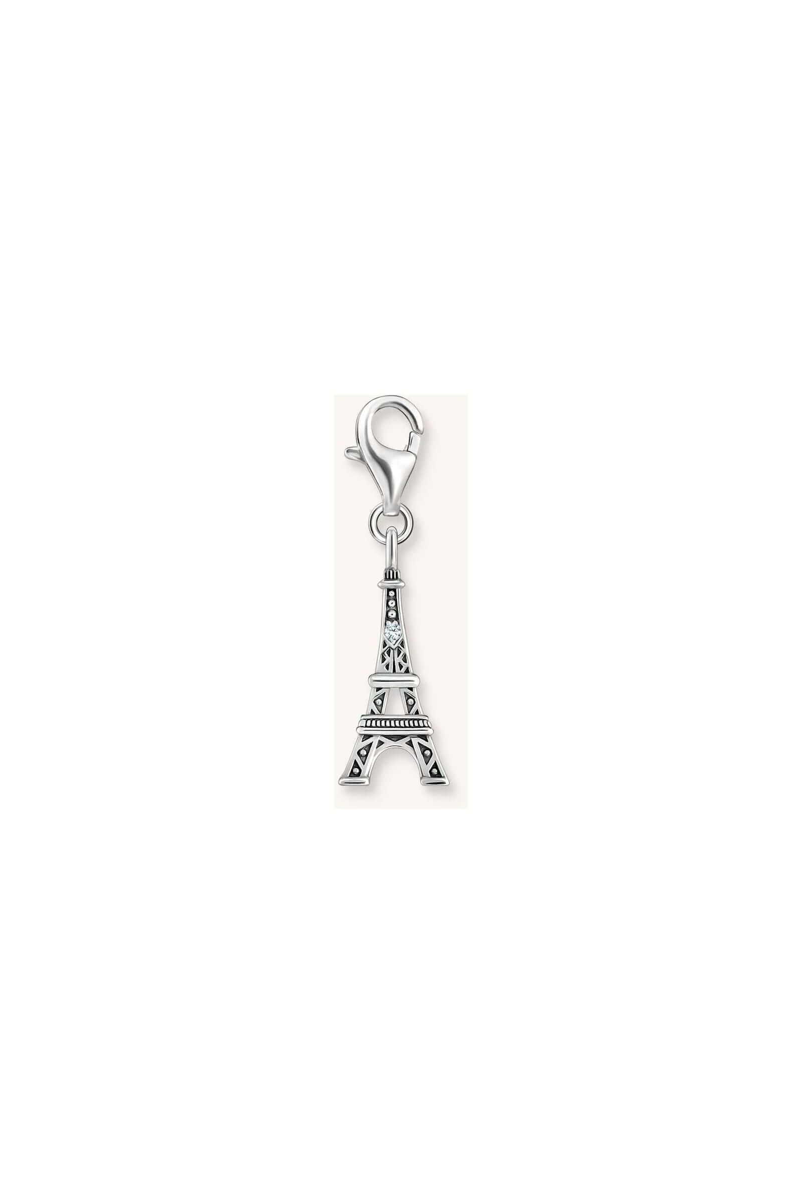 Pendentif charm en argent représentant la tour Eiffel, stylisé avec zircone blanche pour un effet vintage.