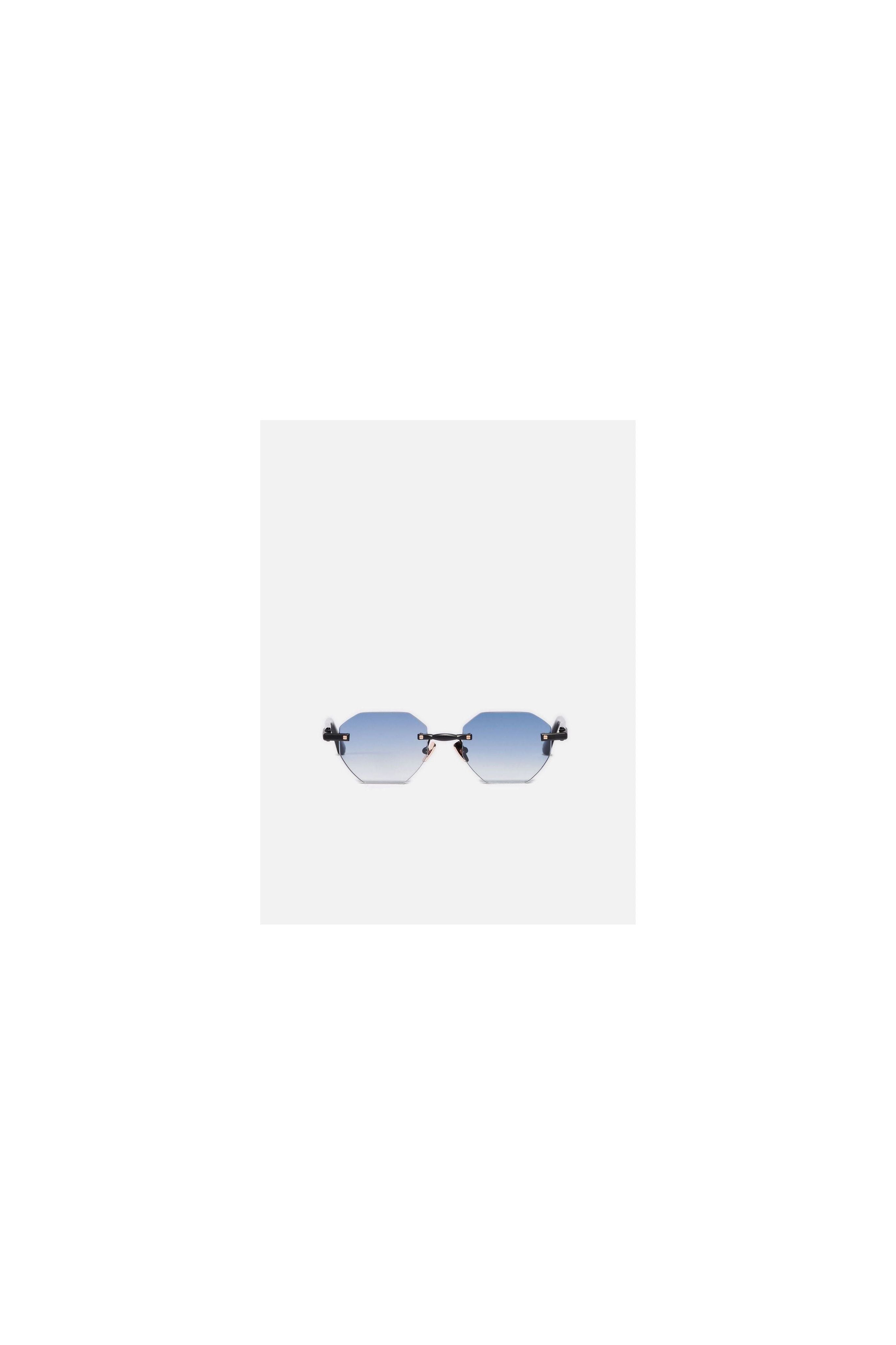 Lunettes de soleil octogonales avec verres dégradés, élégance et protection UV.