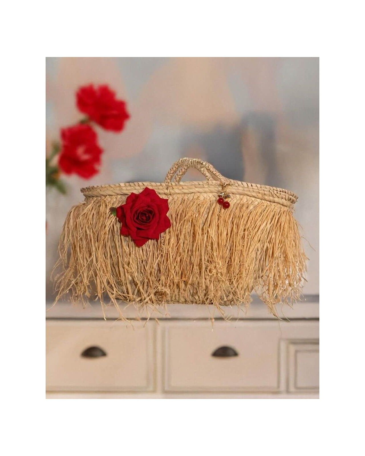 Elegant fringe basket bag with red rose, perfect for summer outings and city days, by Emi S.