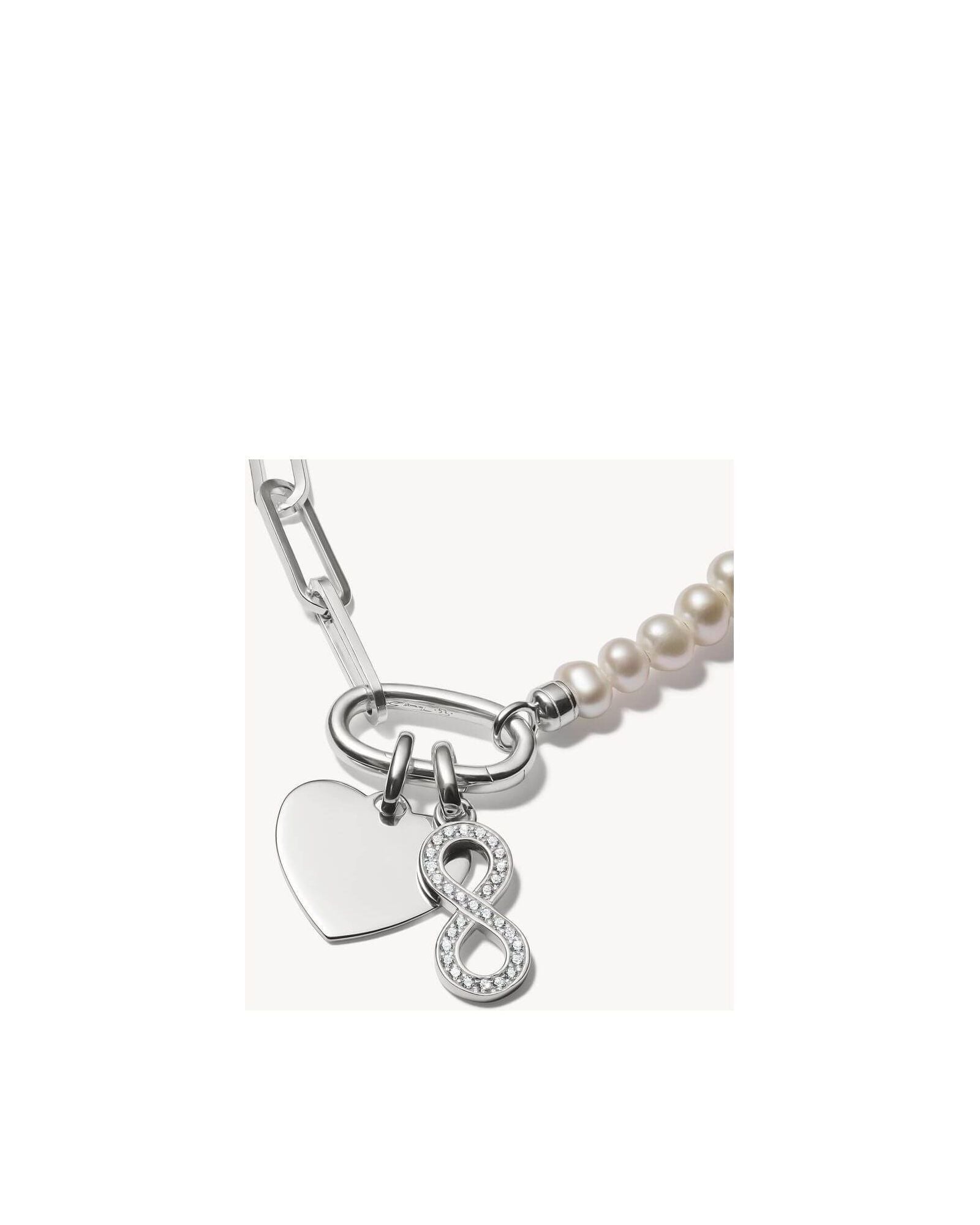Pendentif argent 925 recyclé avec symbole infini et pierres en zirconium, élégant sur chaîne ou bracelet.