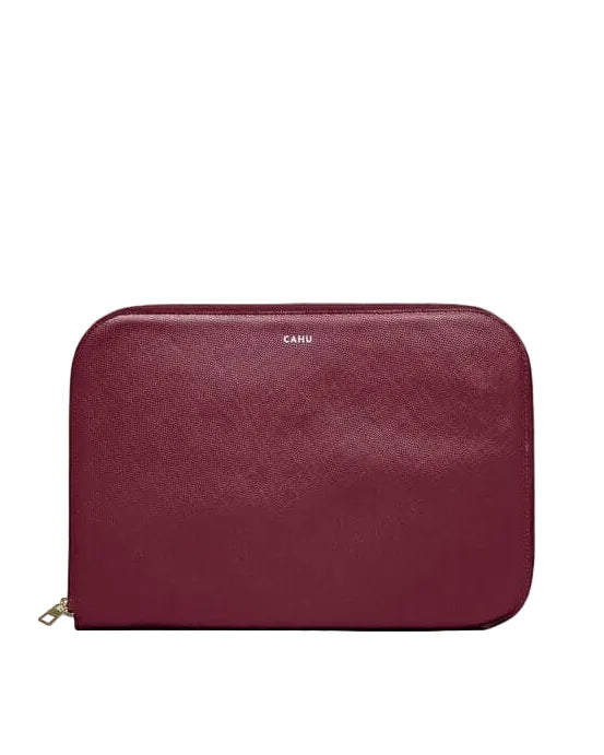La Pochette Claude, burgundy 13-inch laptop sleeve, premium PVC exterior, cotton lining, gold zipper closure.