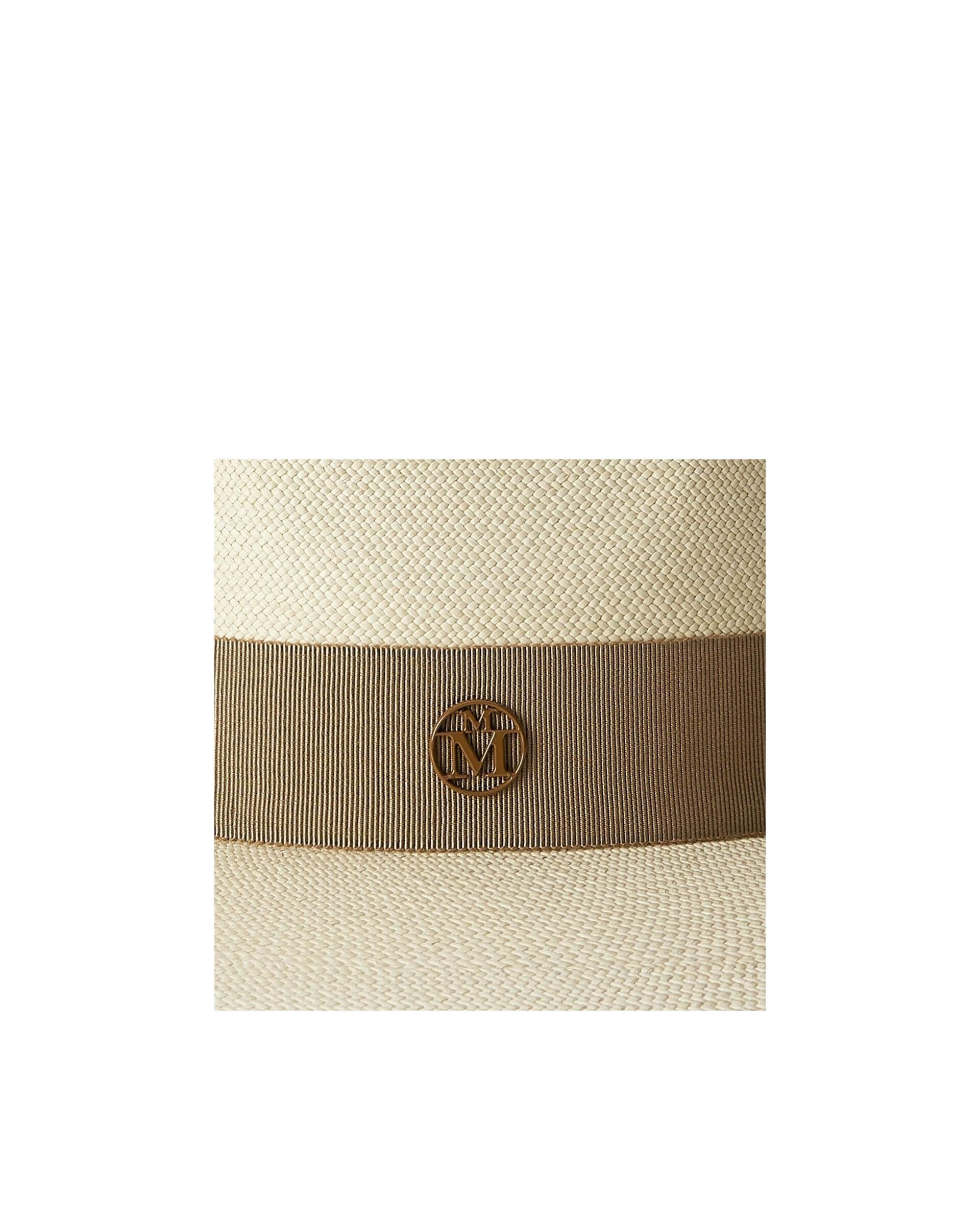 Close-up of the Chapeau Charles timeless Cuenca hat featuring a stylish ribbon and emblem detail.