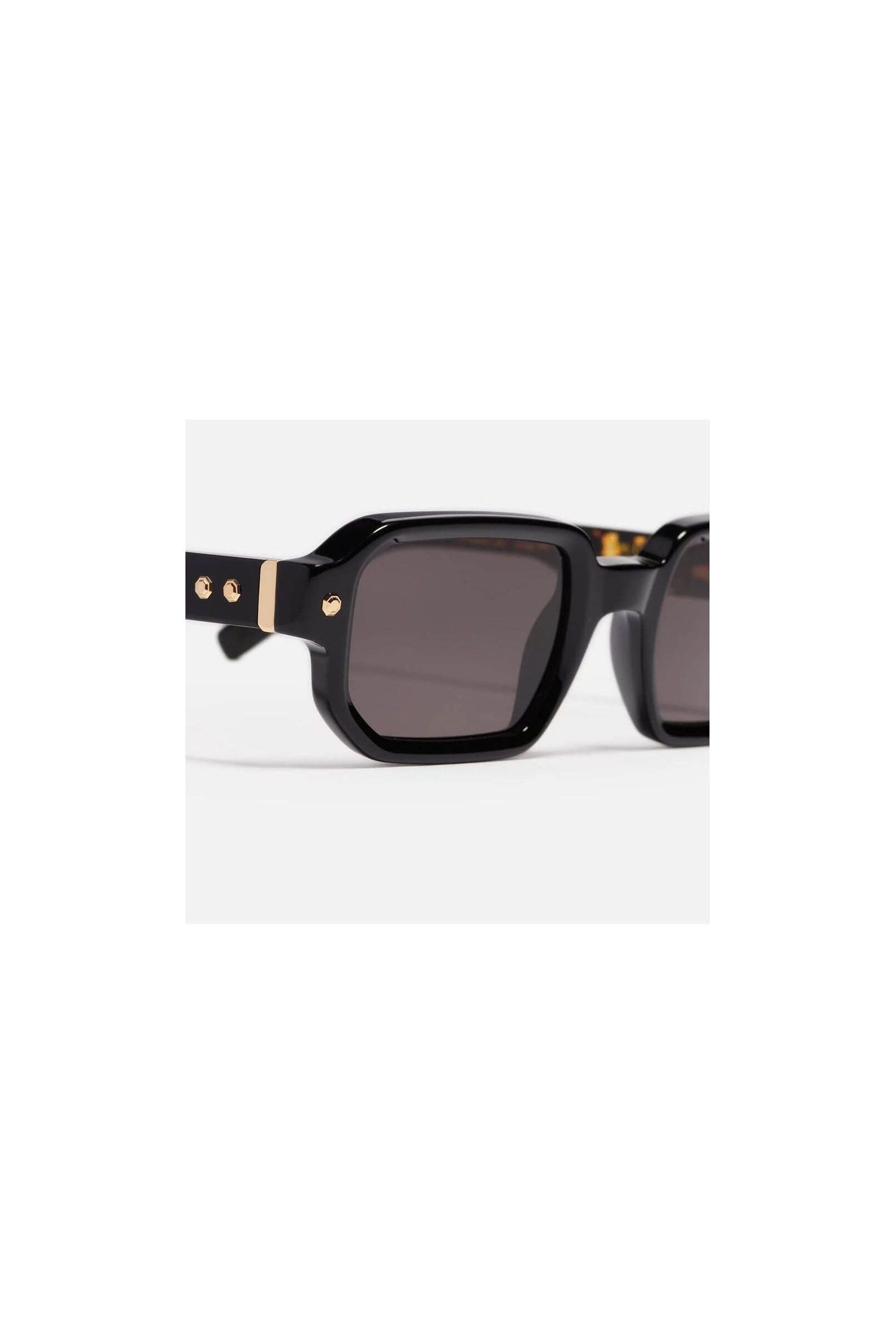 Shiny black rectangular sunglasses with gold accents from Project 06, unisex design.