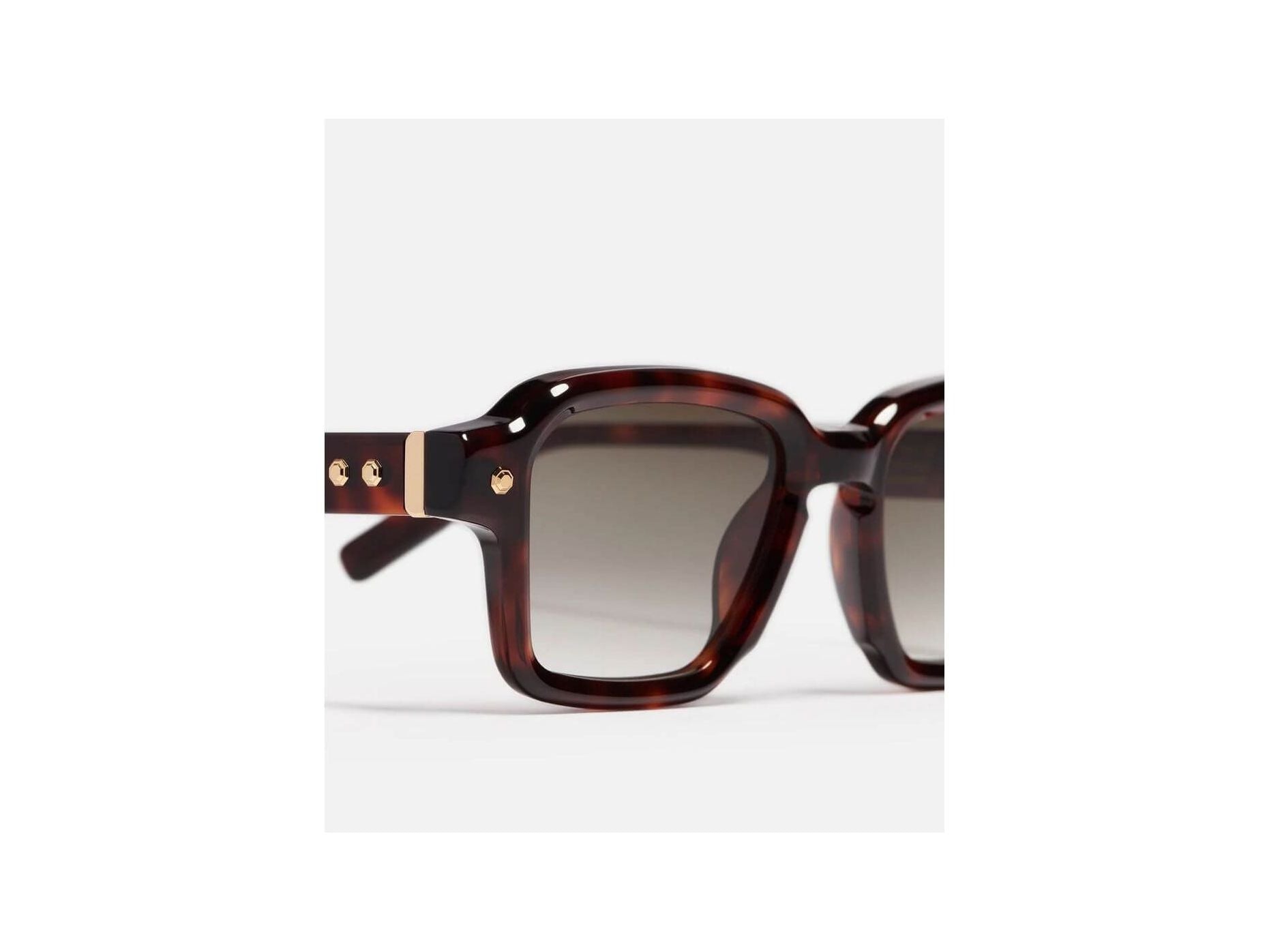 Dark brown tortoise sunglasses with rectangular frame and decorative studs by John Dalia, Project 07 series.