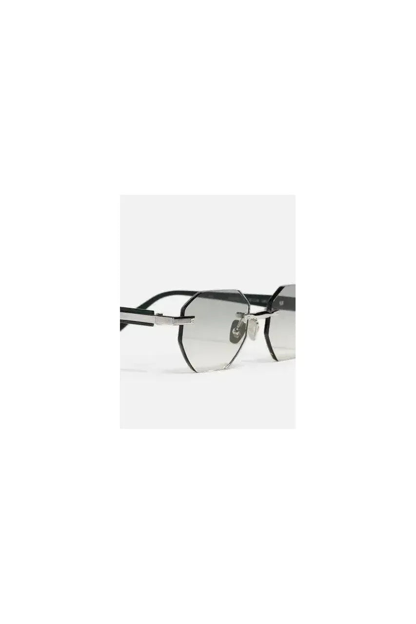 Lunettes de soleil Timothy C545 en platine plaqué, design octogonal élégant et moderne, parfaites pour un style raffiné.