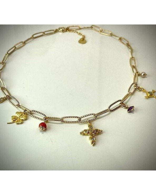Collier Mystique Corsica: elegant gold necklace with unique charms symbolizing beauty and mysticism.