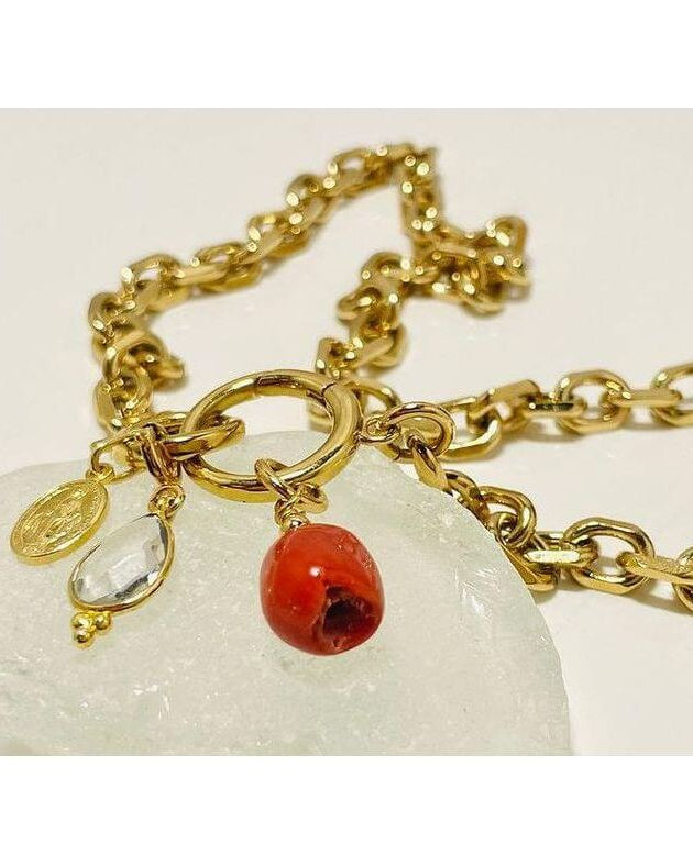 Collier Madone bracelet featuring Mediterranean red coral and gold links, showcasing elegance and craftsmanship.