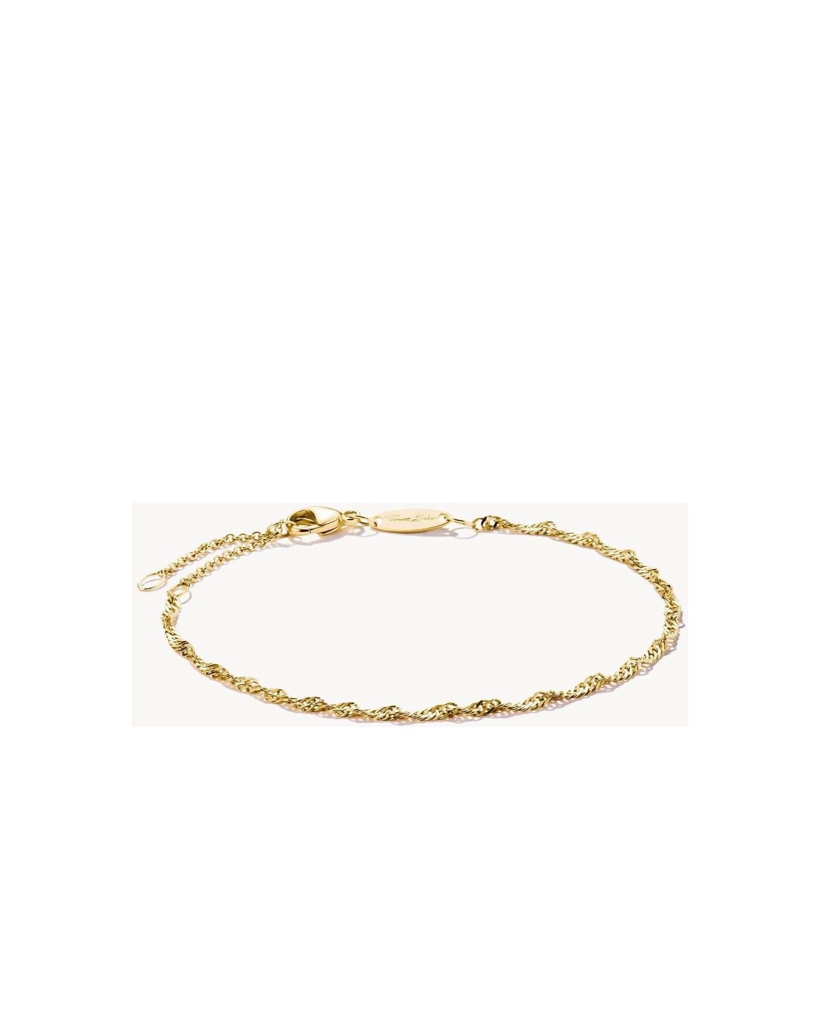 Charm bracelet in gold plating featuring a twisted design, perfect for adding elegance to any outfit.