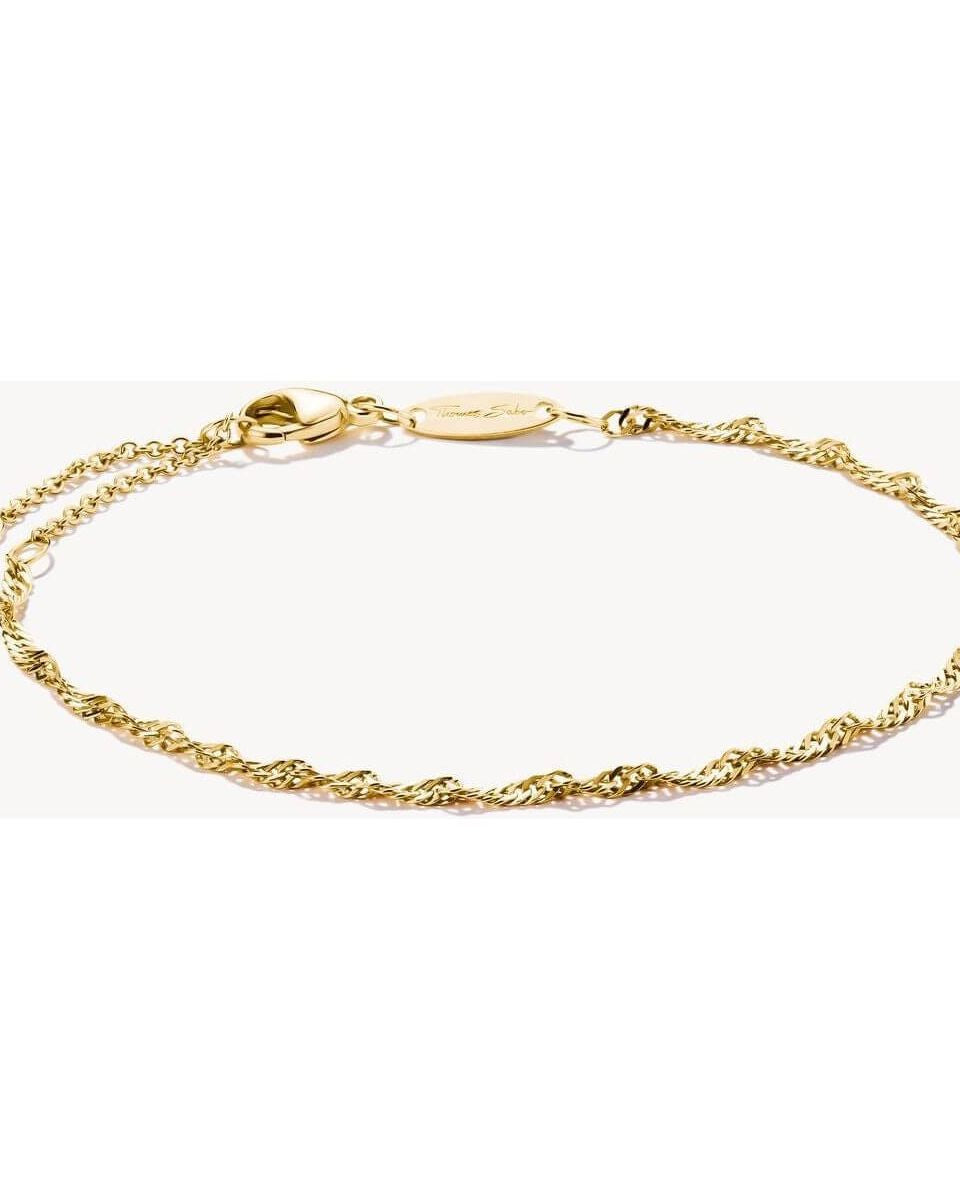 Bracelet charm Singapour en plaqué or 18 carats, design filigrane spirale, ajustable pour un style personnalisé.