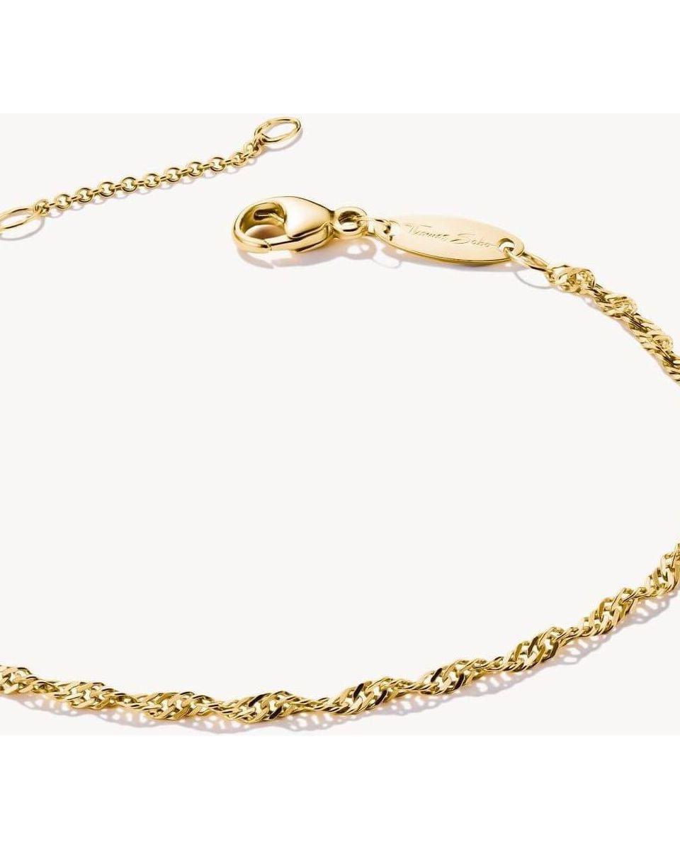 Elegant gold-plated bracelet with spiral filigree design and adjustable length, perfect for personalized style.