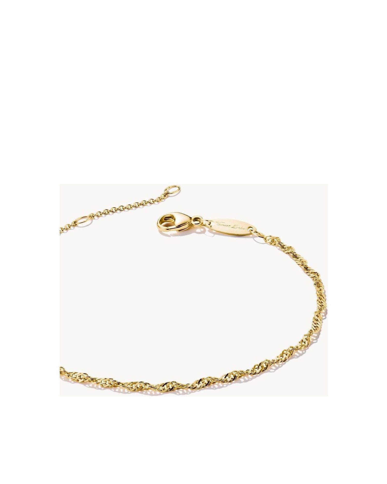 Elegant gold-plated bracelet with spiral filigree design and adjustable length, perfect for personalized style.