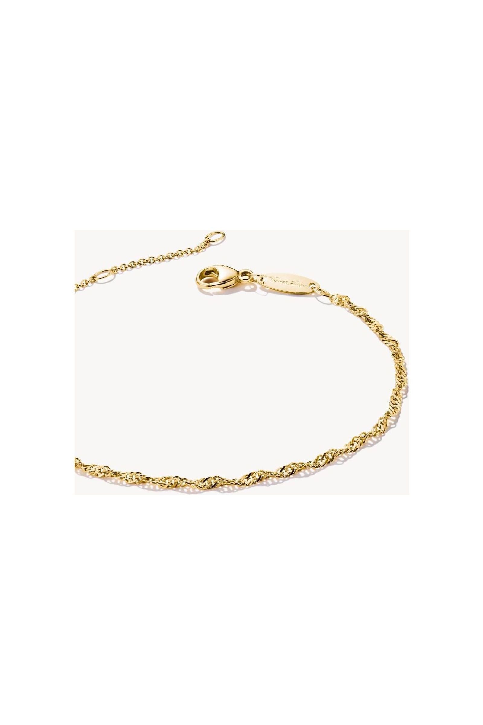 Elegant gold-plated bracelet with spiral filigree design and adjustable length, perfect for personalized style.