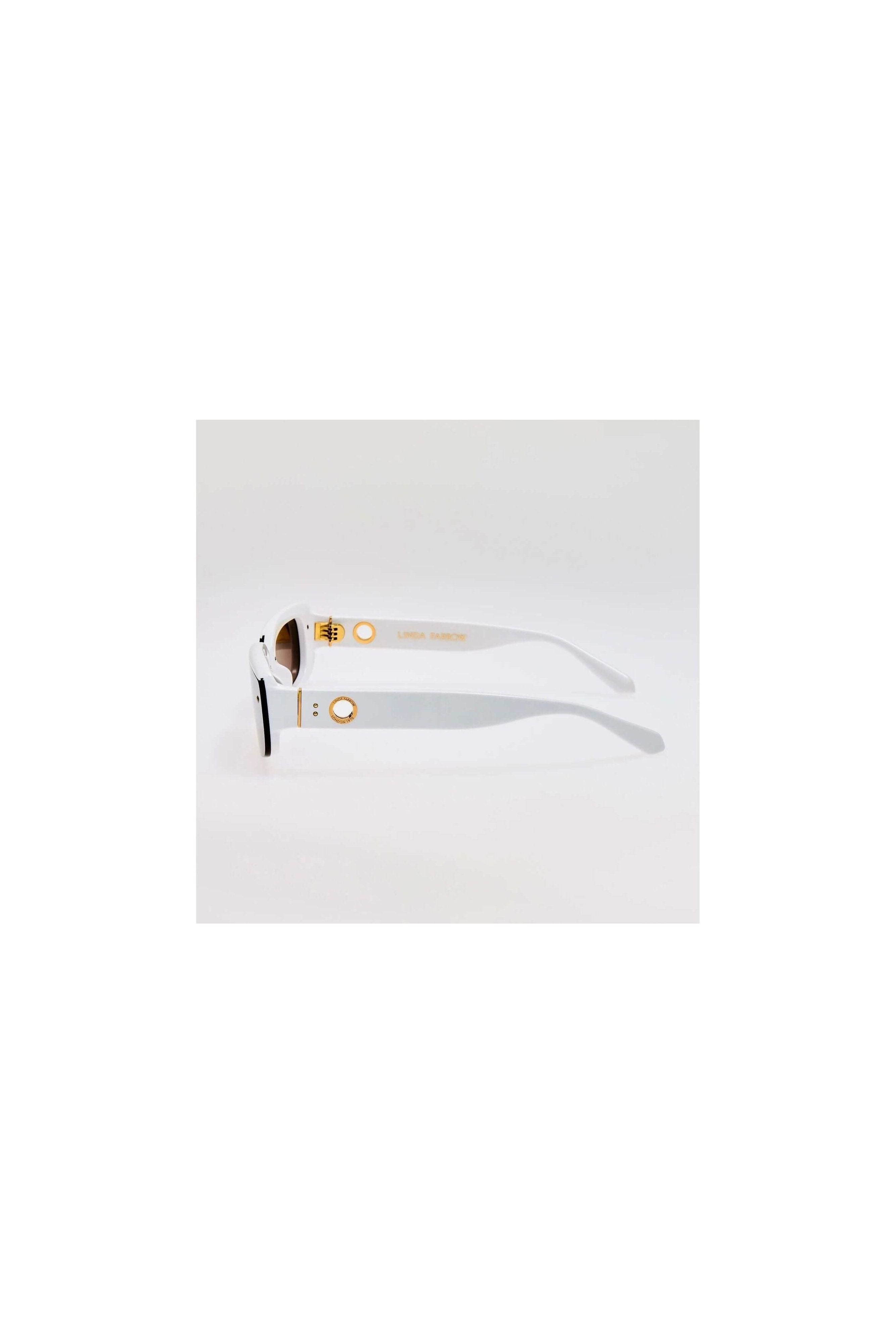Lunettes de soleil Flick blanches en acétate, offrant élégance et protection UV à 100%.