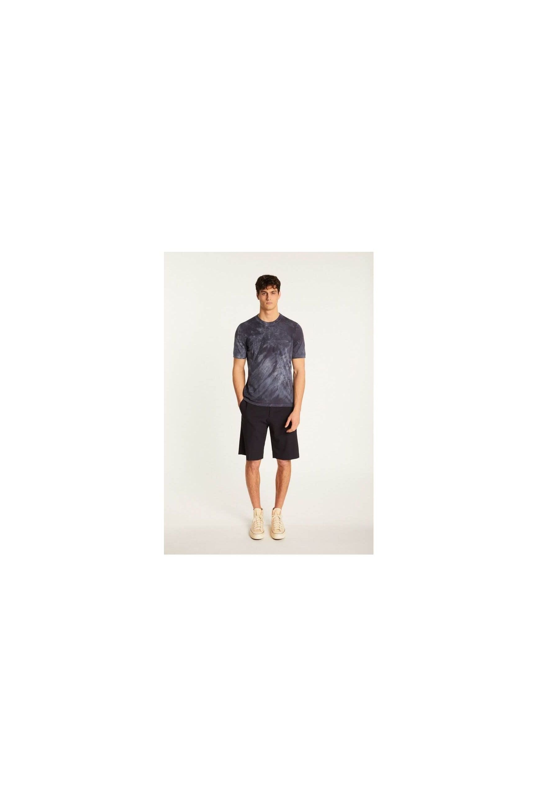 Model wearing T-Shirt Marquez in navy, paired with shorts for a casual summer look.