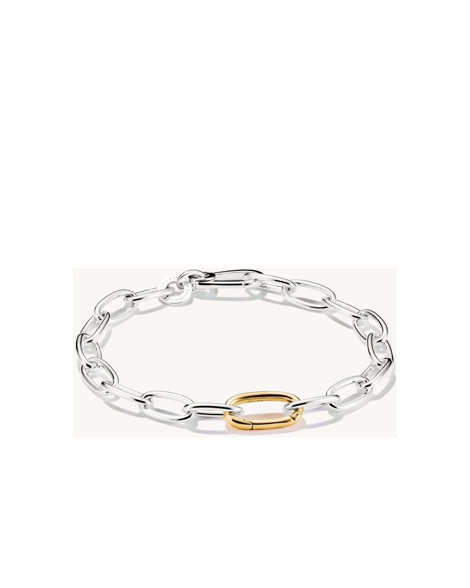 Bracelet charm bicolore en argent 925 avec maillon central doré, design moderne et élégant.