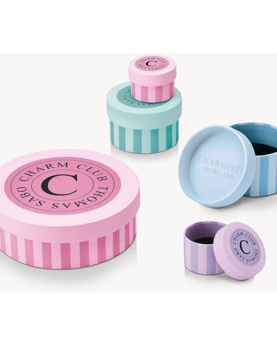Colorful Charm Club gift boxes in pastel shades for elegant jewelry storage.