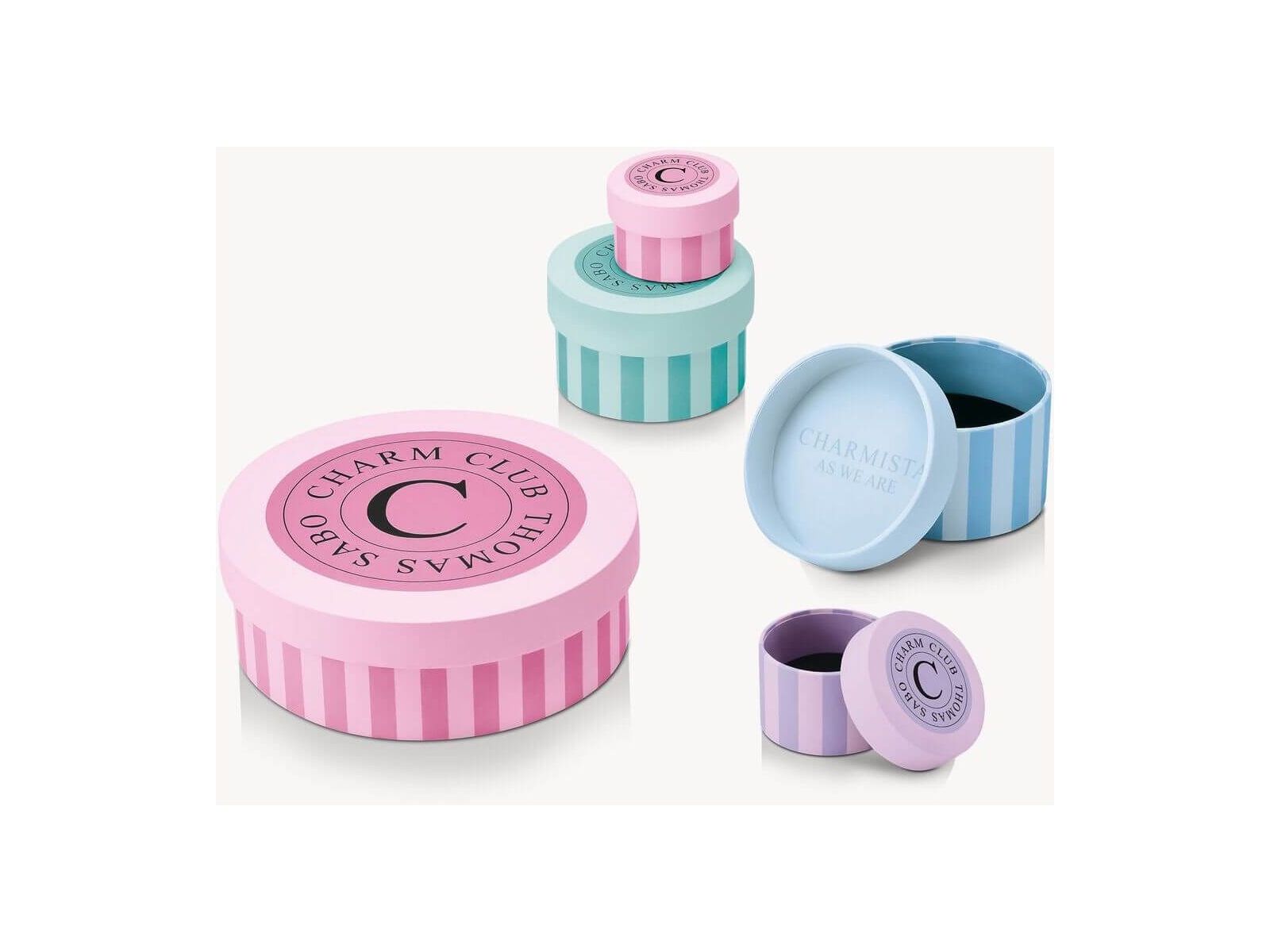Colorful Charm Club gift boxes in pastel shades for elegant jewelry storage.