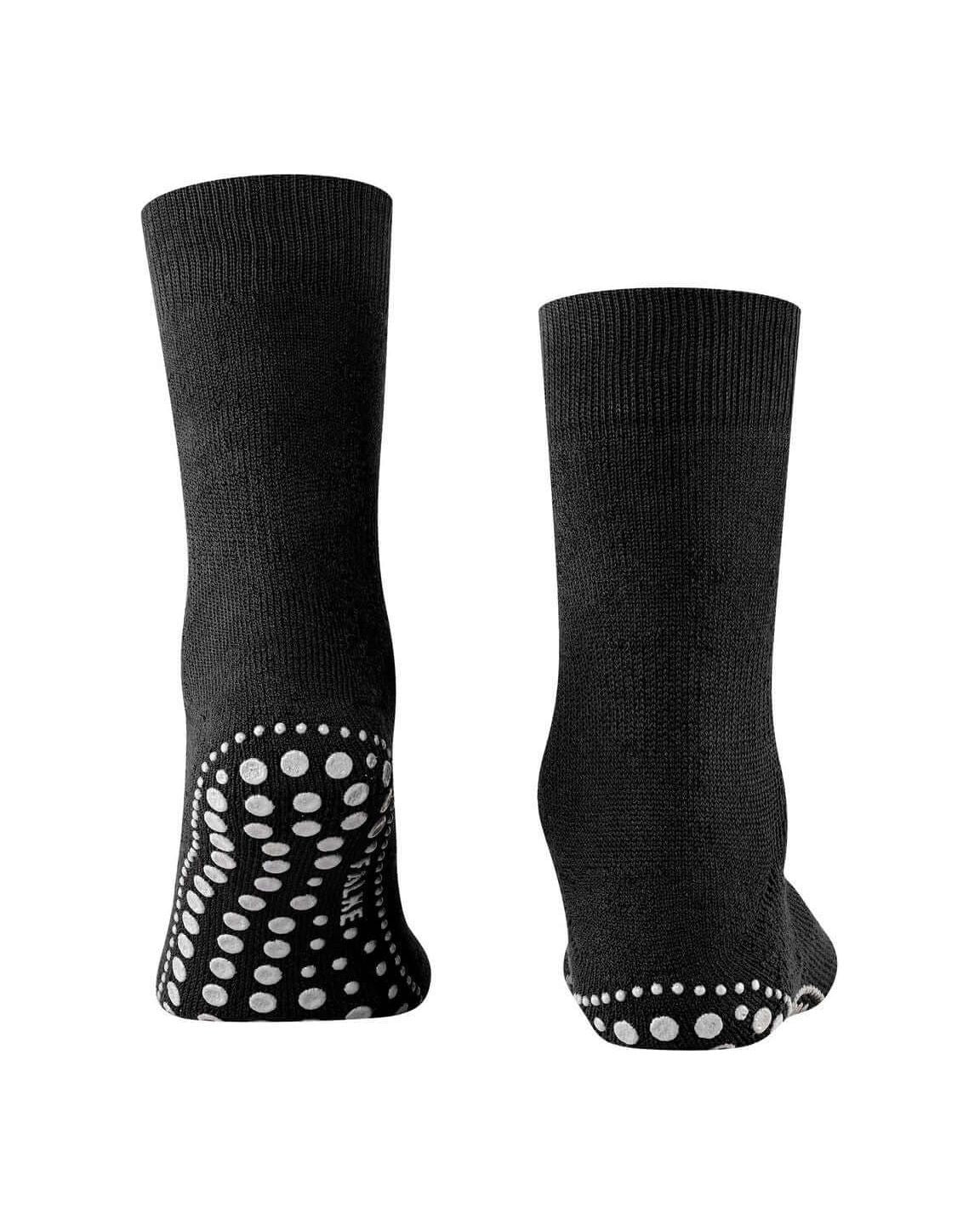 Chaussettes Homepads en noir avec picots en silicone pour une adhérence optimale à la maison.