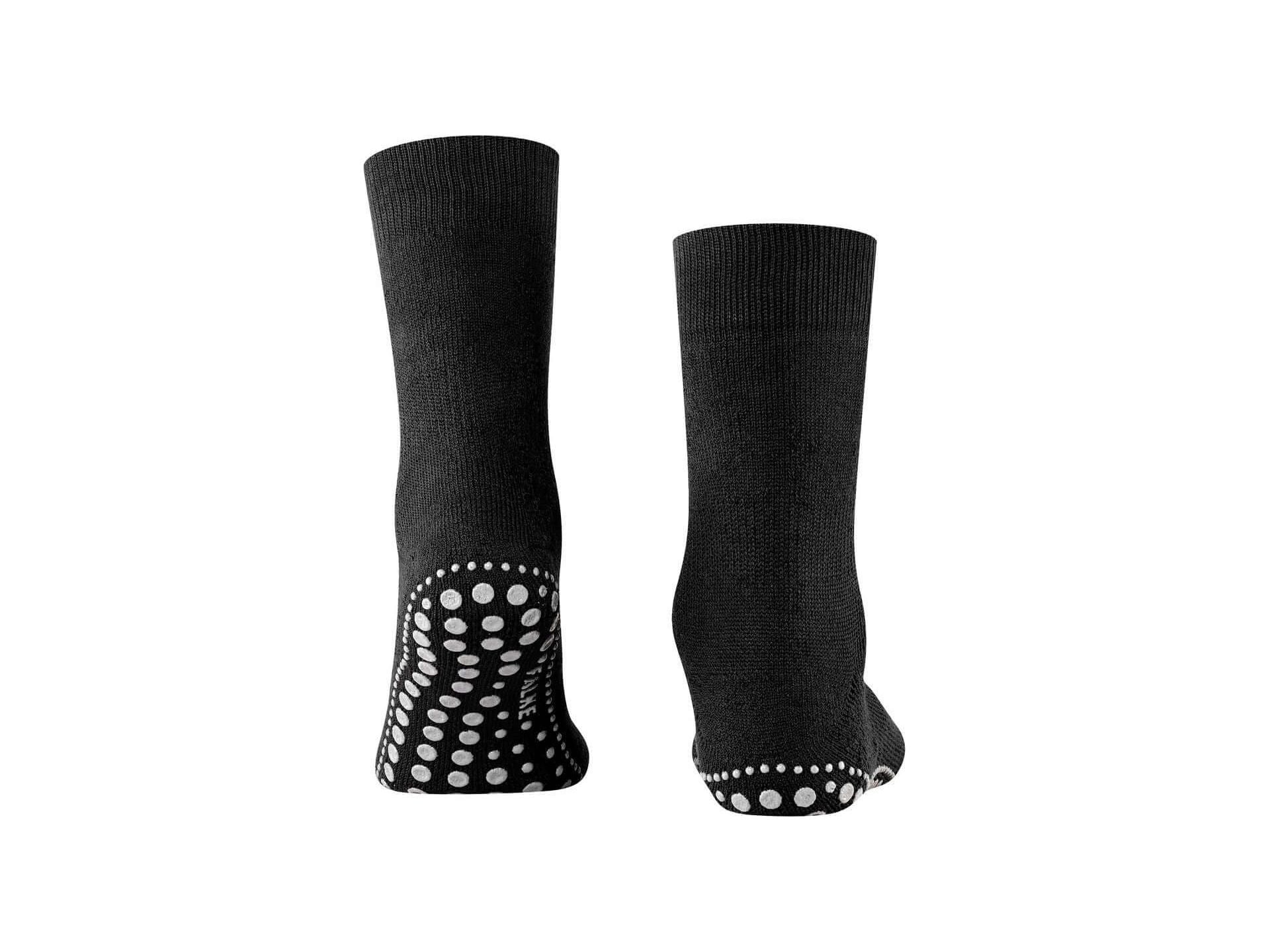 Chaussettes Homepads en noir avec picots en silicone pour une adhérence optimale à la maison.