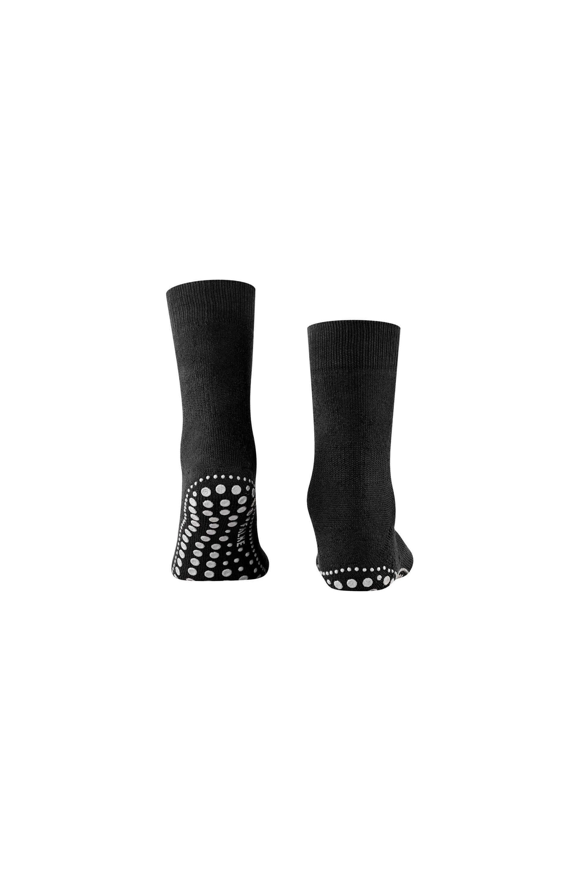 Chaussettes Homepads en noir avec picots en silicone pour une adhérence optimale à la maison.