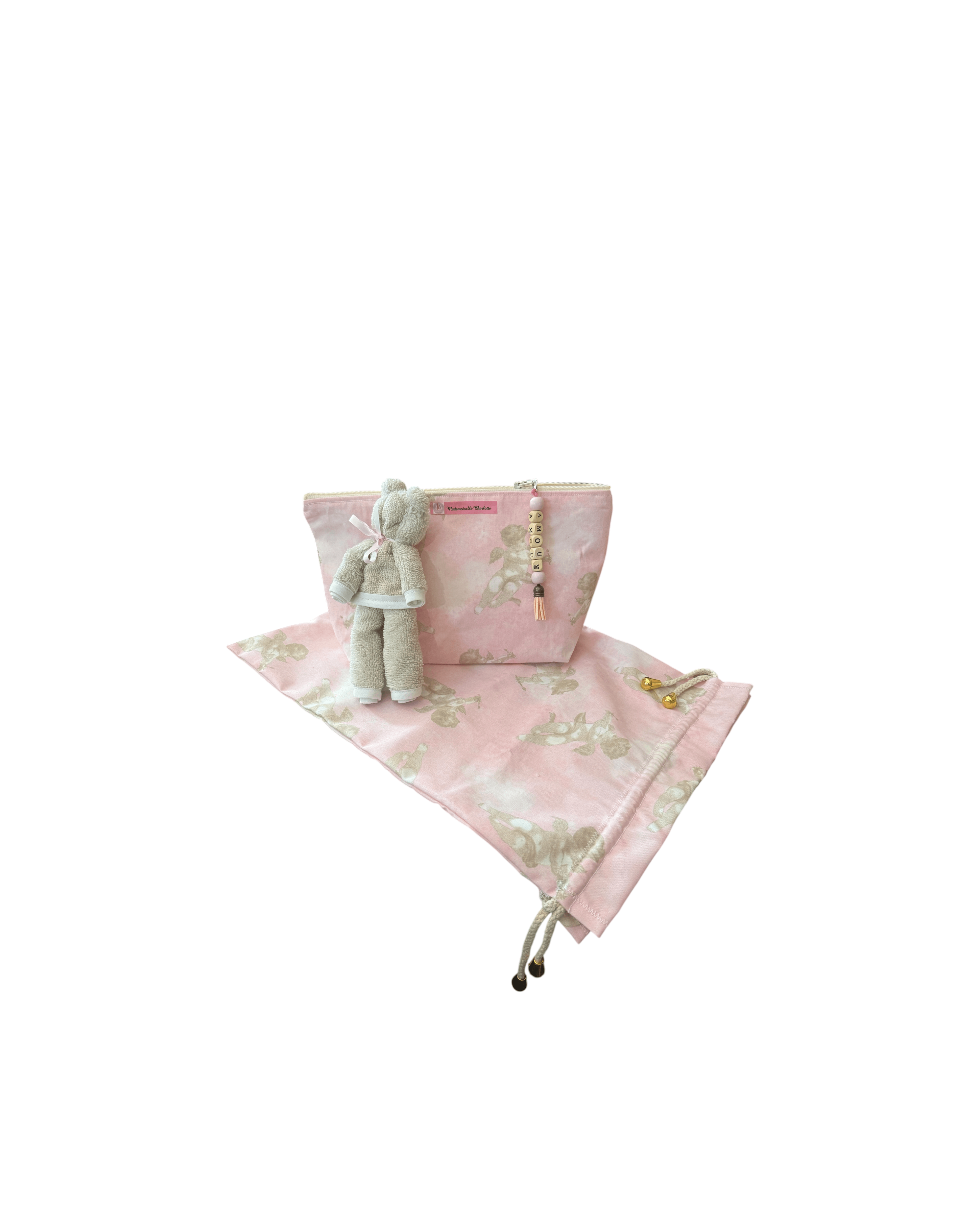 Pochette bébé en tissu rose avec doudou, parfaite pour le change et le rangement lors des déplacements.