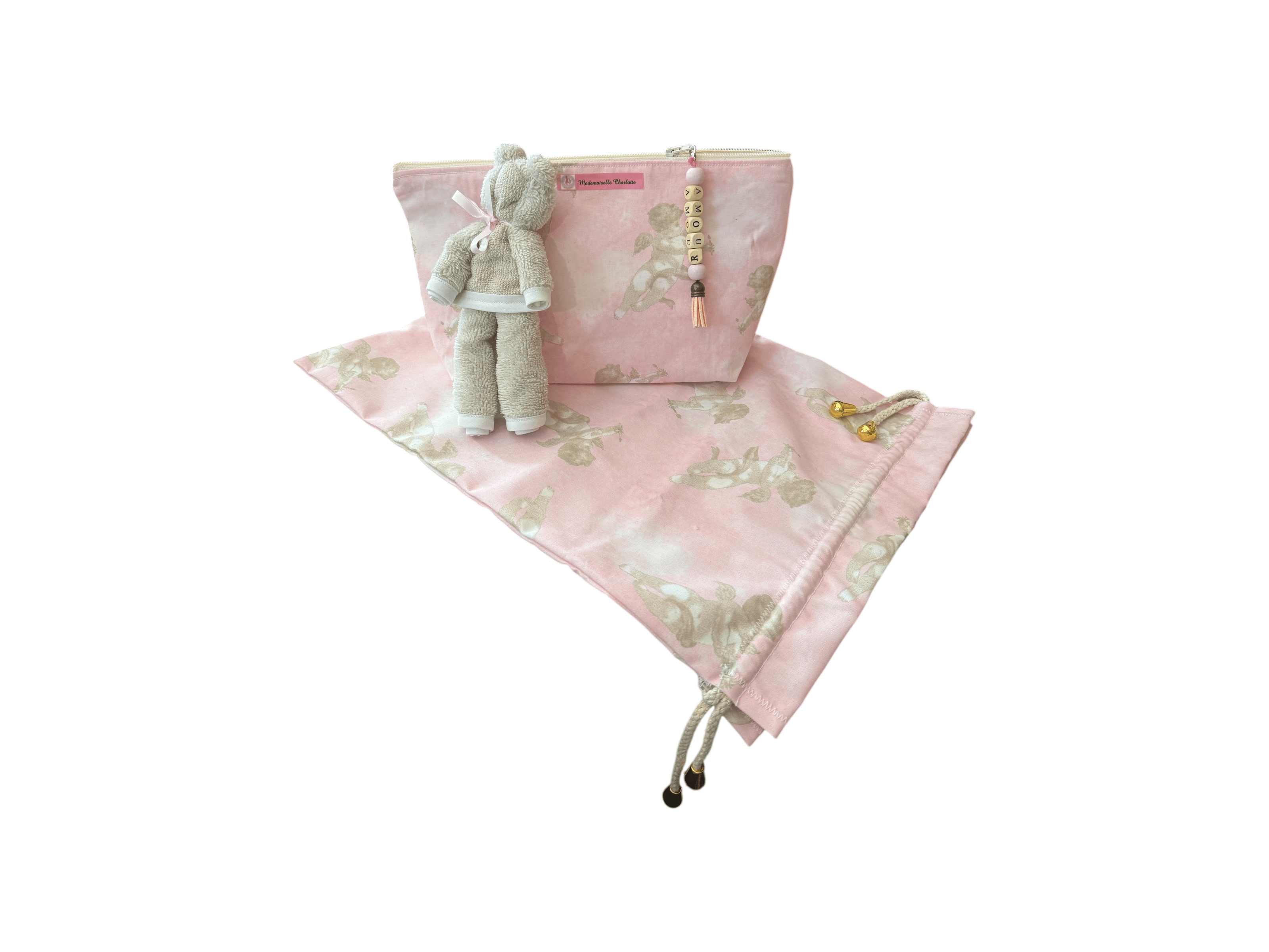 Pochette bébé en tissu rose avec doudou, parfaite pour le change et le rangement lors des déplacements.