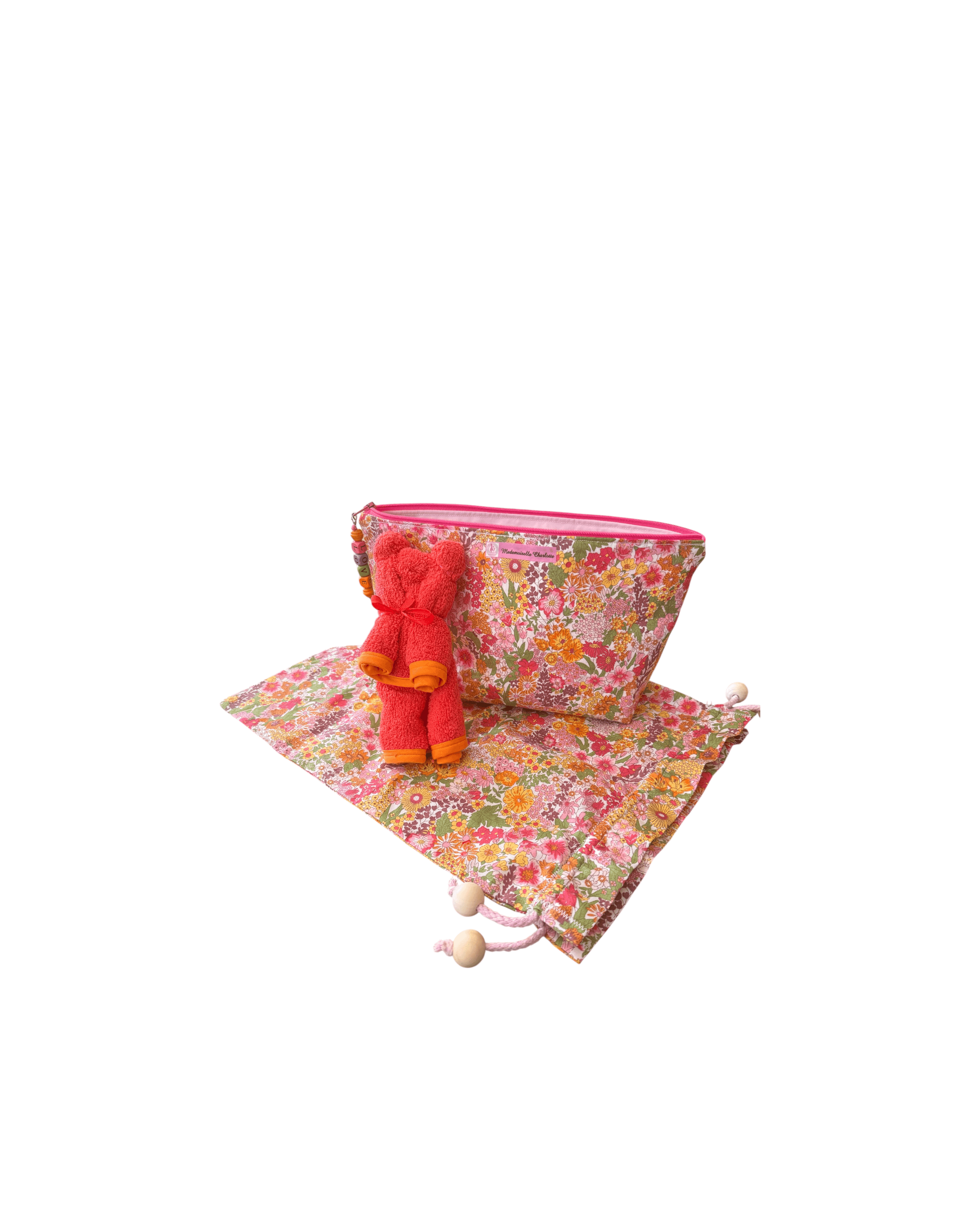 Pochette bébé en tissu floral avec sac de rangement et serviette, pratique pour changer votre enfant en toute élégance.