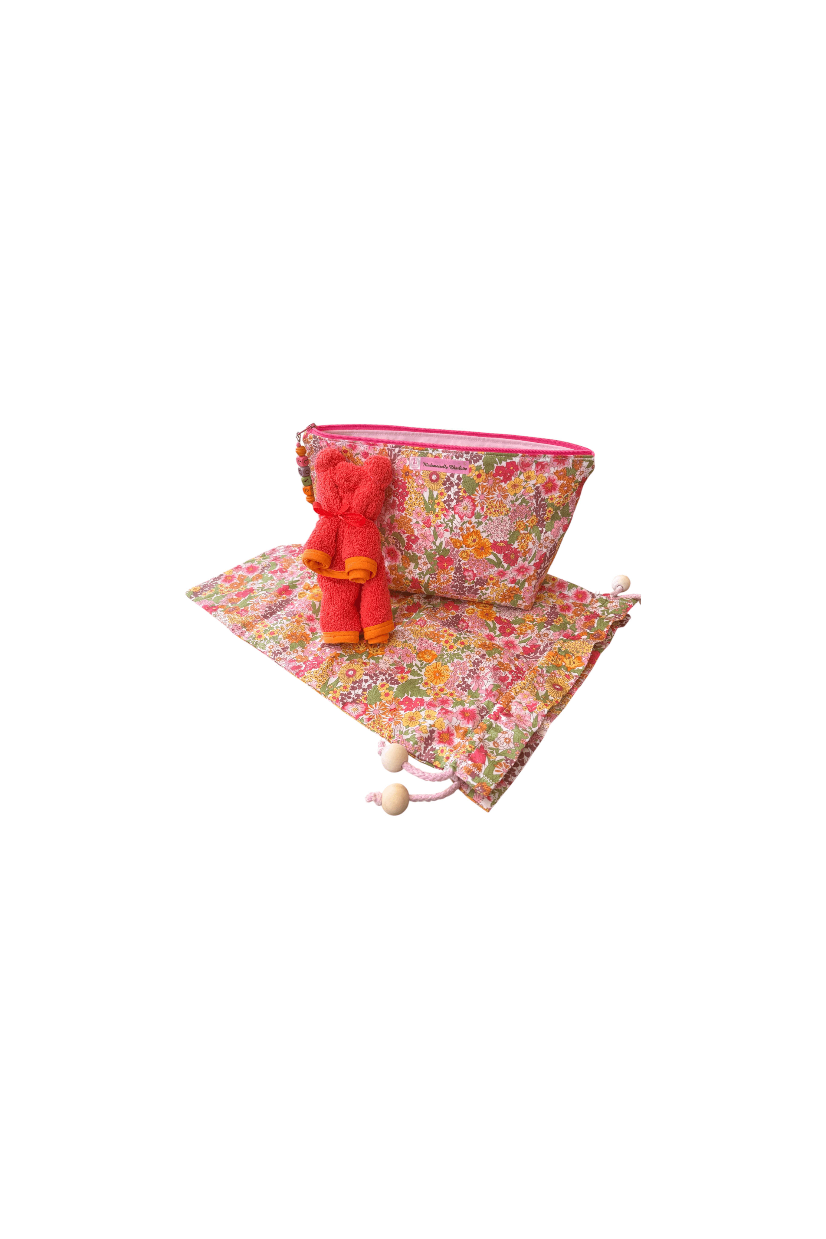 Pochette bébé en tissu floral avec sac de rangement et serviette, pratique pour changer votre enfant en toute élégance.