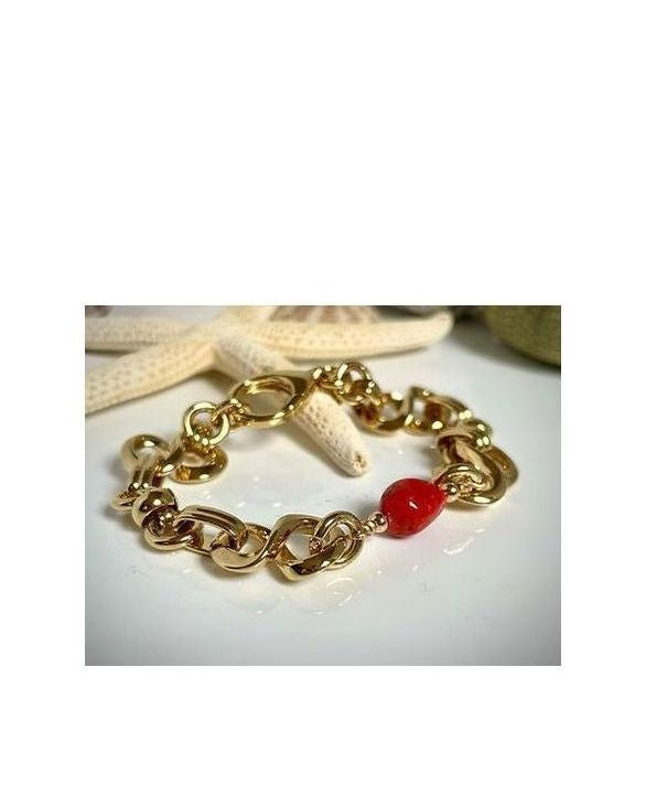 Bracelet Créazione en or avec maillons et perle de corail rouge de Méditerranée, design élégant et durable.