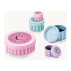 Colorful charming gift boxes with pink and blue designs for Charm Club by Thomas Sabo.