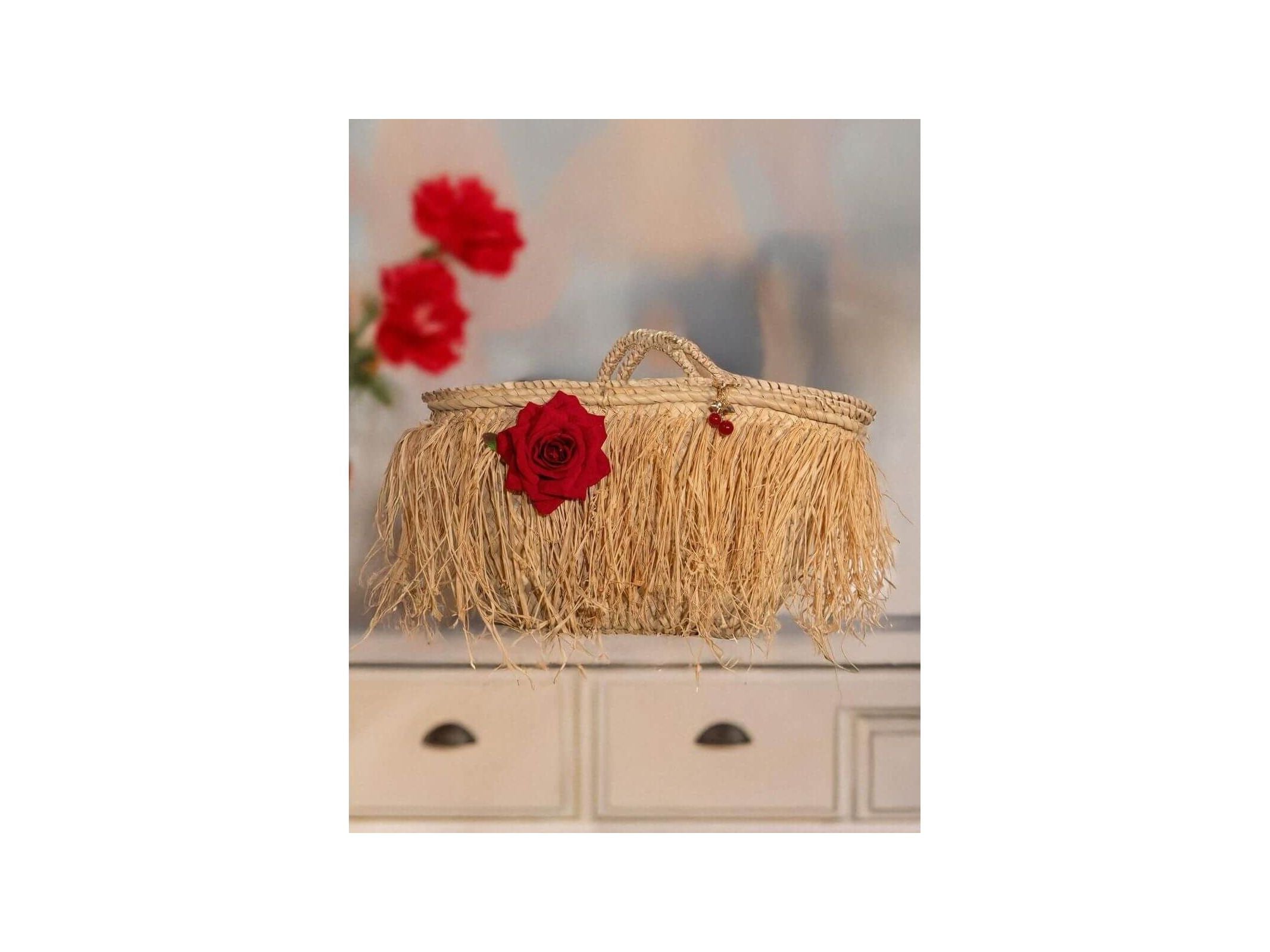 Elegant fringe basket bag with red rose, perfect for summer outings and city days, by Emi S.