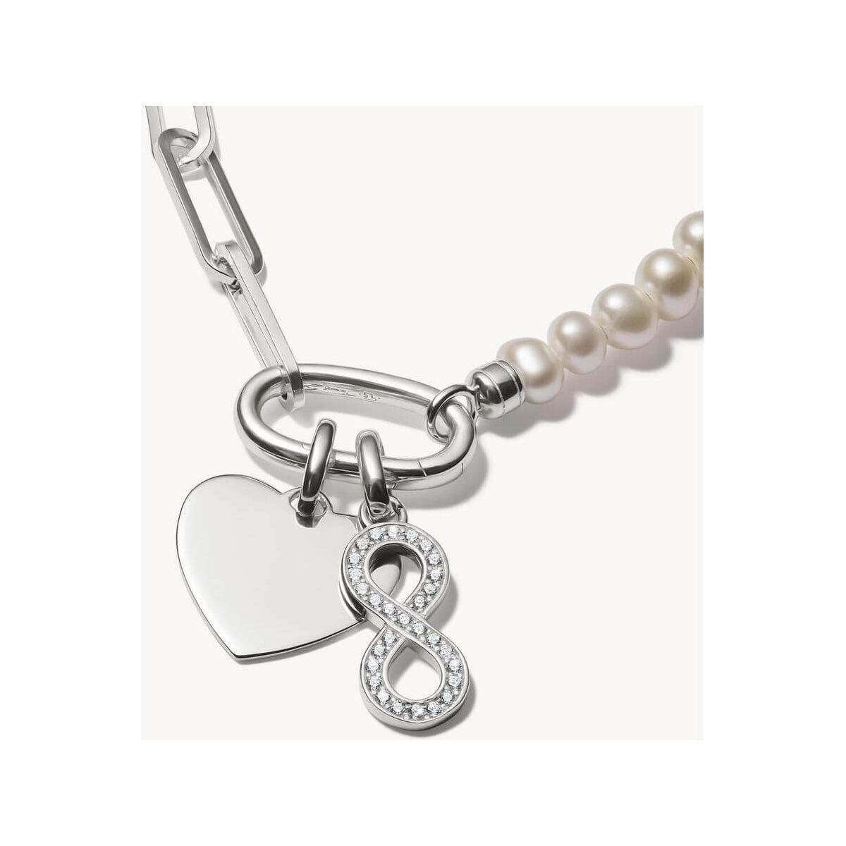 Pendentif argent 925 recyclé avec symbole infini et pierres en zirconium, élégant sur chaîne ou bracelet.