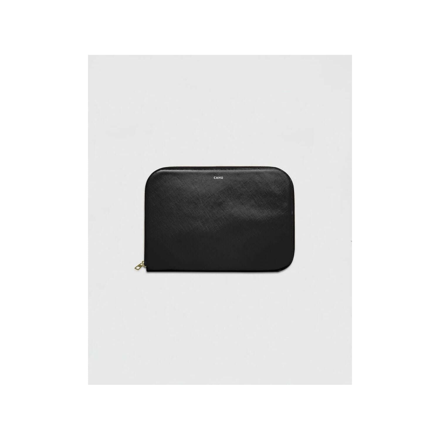 La Pochette Claude: sleek black laptop sleeve with golden zipper, made from durable, waterproof PVC, features cotton lining.