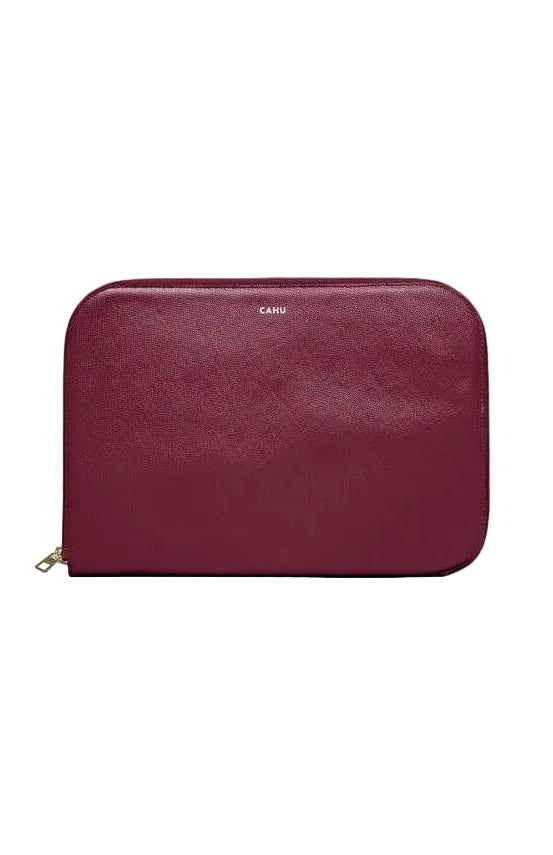 La Pochette Claude, burgundy 13-inch laptop sleeve, premium PVC exterior, cotton lining, gold zipper closure.