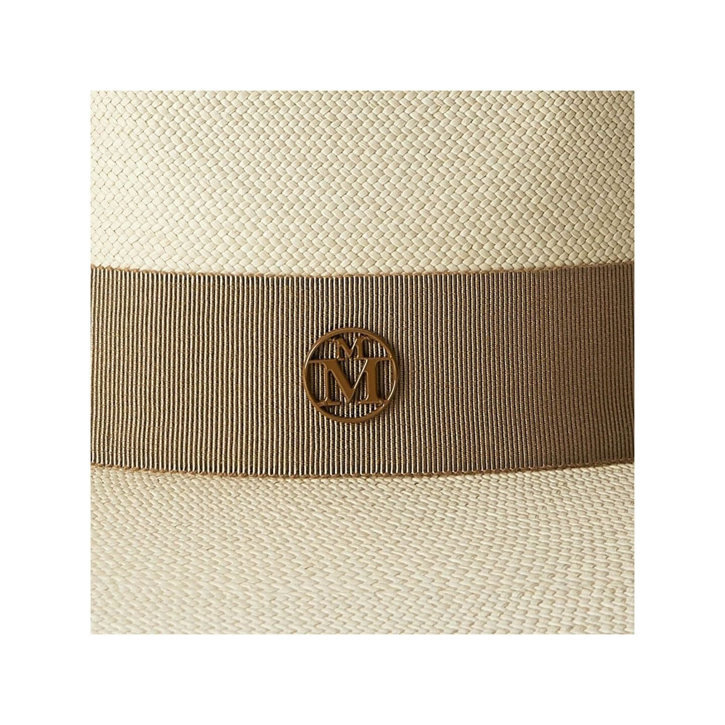 Close-up of the Chapeau Charles timeless Cuenca hat featuring a stylish ribbon and emblem detail.