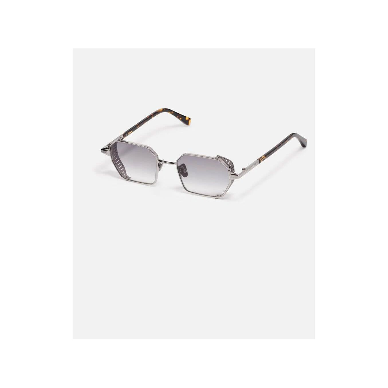 Lunettes de soleil Dennis C423 avec monture géométrique en acier inoxydable et détails en titane finition bronze.