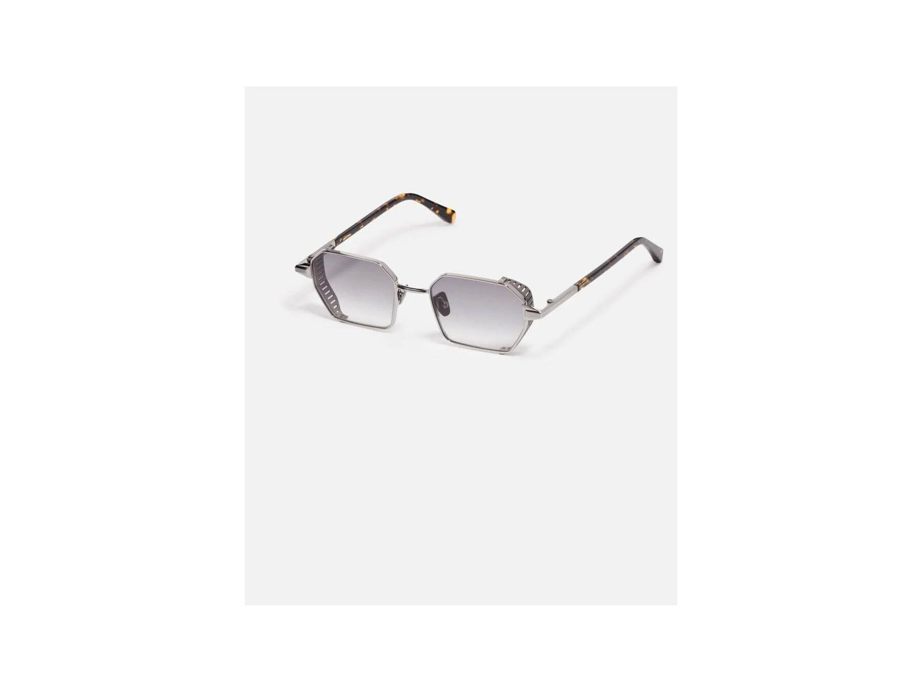 Lunettes de soleil Dennis C423 avec monture géométrique en acier inoxydable et détails en titane finition bronze.