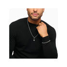 Man wearing a silver Midnight Rose pendant necklace and bracelet, showcasing stylish jewelry design.