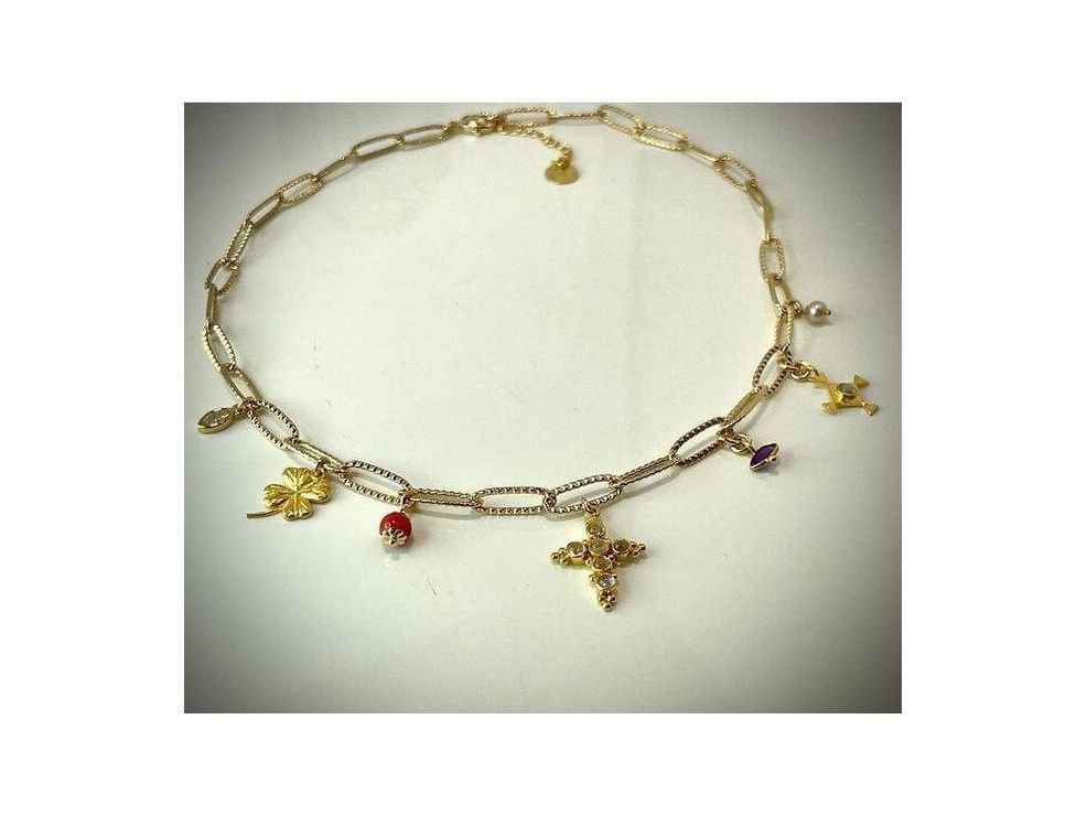 Collier Mystique Corsica: elegant gold necklace with unique charms symbolizing beauty and mysticism.