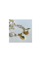 Bracelet Jardin featuring pearls, green apatite stones, and a gold floral charm, celebrating Mediterranean spring.