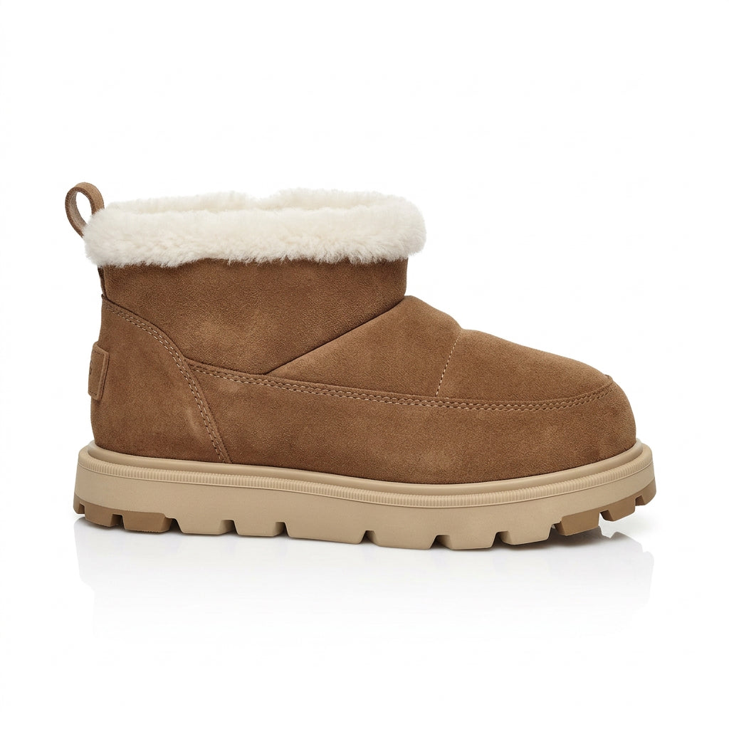 Bottes EDEN BOOTIE en daims taupe avec bordure en fausse fourrure, semelle en caoutchouc, confort optimal.
