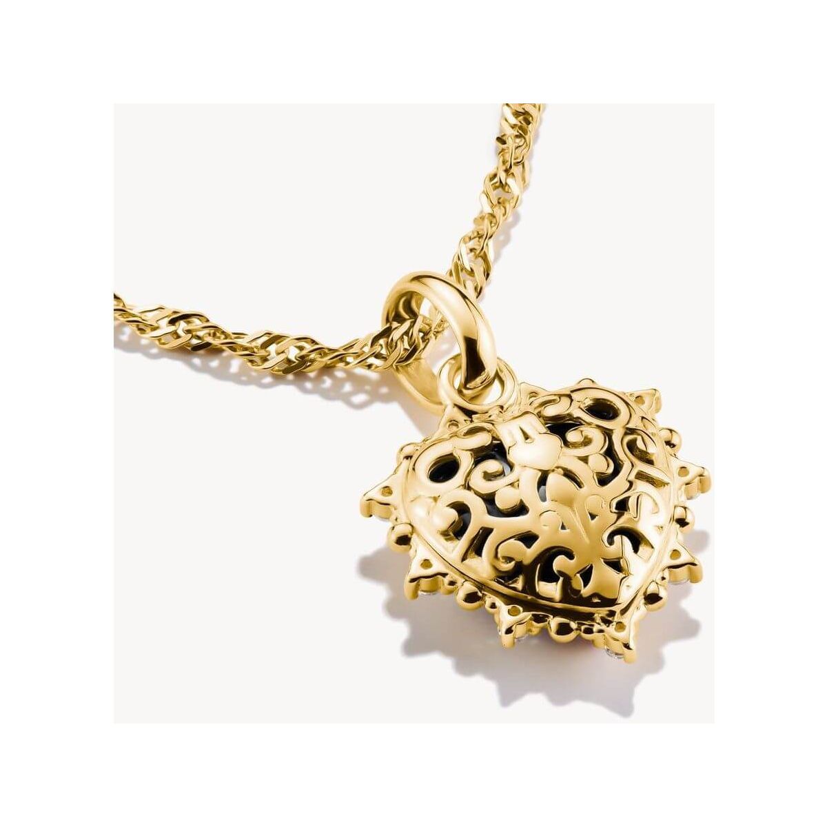 Charm cœur vintage plaqué or, design filigrane avec zirconium noir, bijou élégant à porter des deux côtés.
