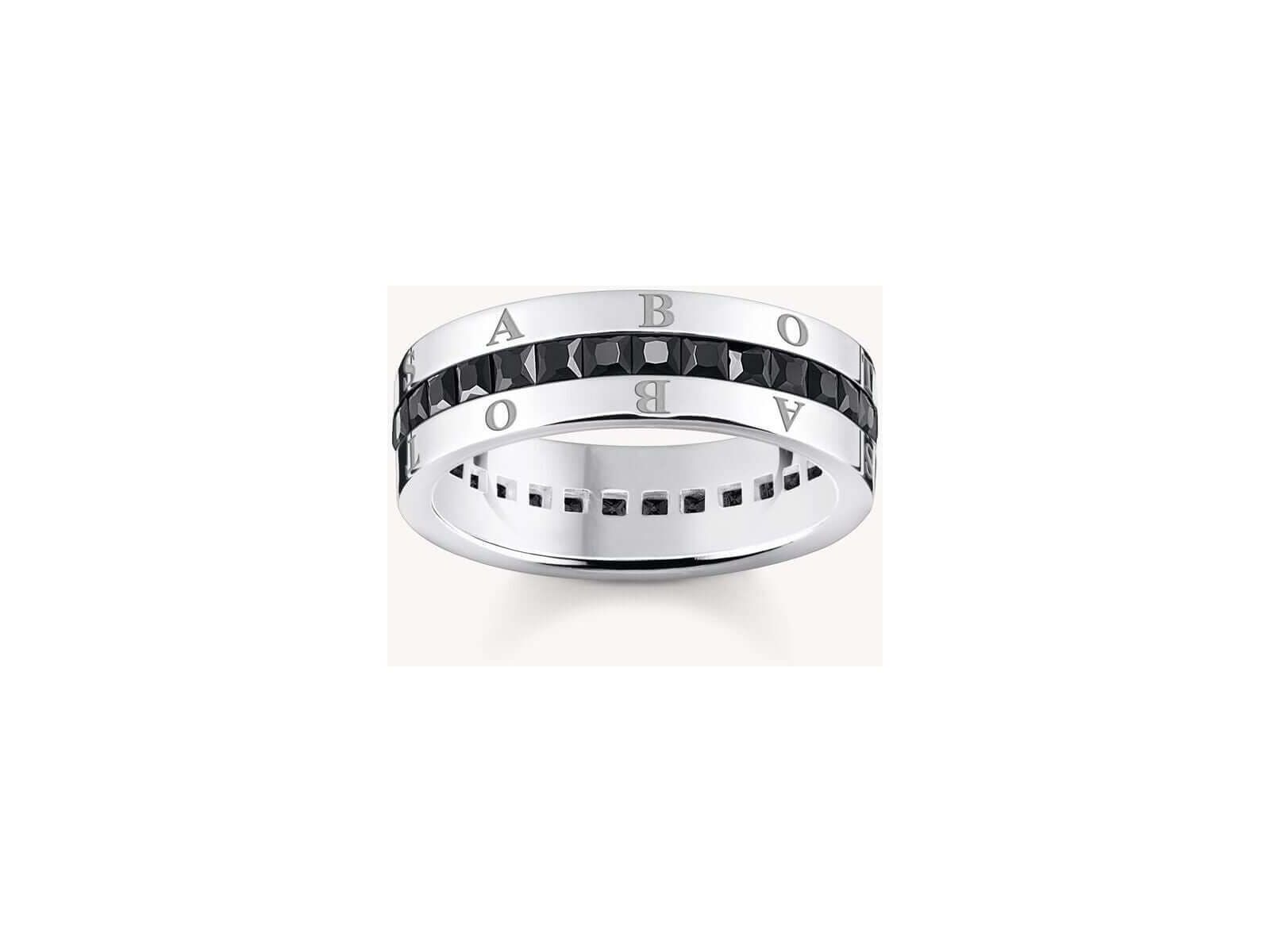 Bague ruban en argent 925 avec zircones noires, gravure élégante, design raffiné et confort optimal.