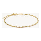 Bracelet charm Singapour en plaqué or 18 carats, design filigrane spirale, ajustable pour un style personnalisé.