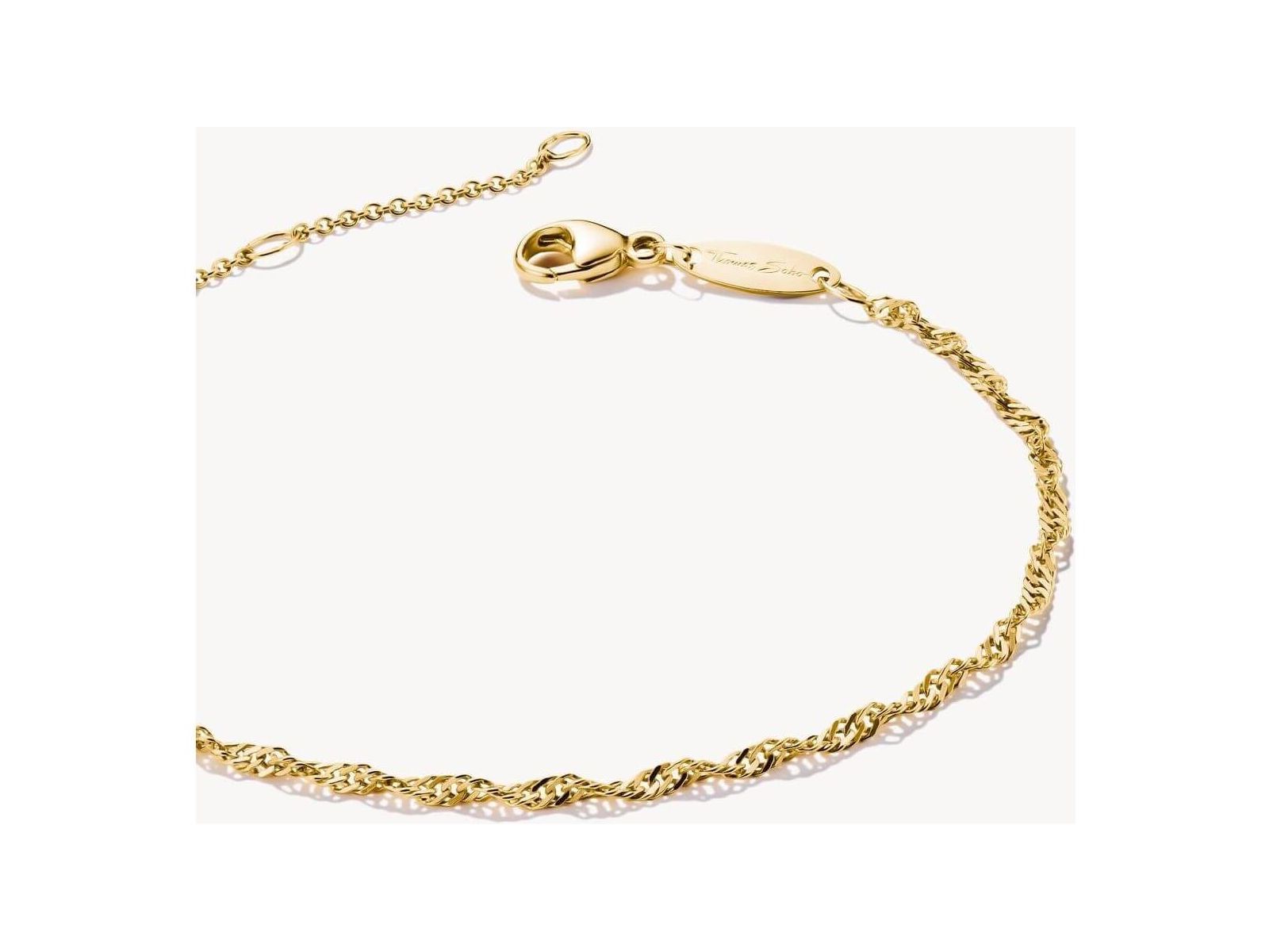 Elegant gold-plated bracelet with spiral filigree design and adjustable length, perfect for personalized style.